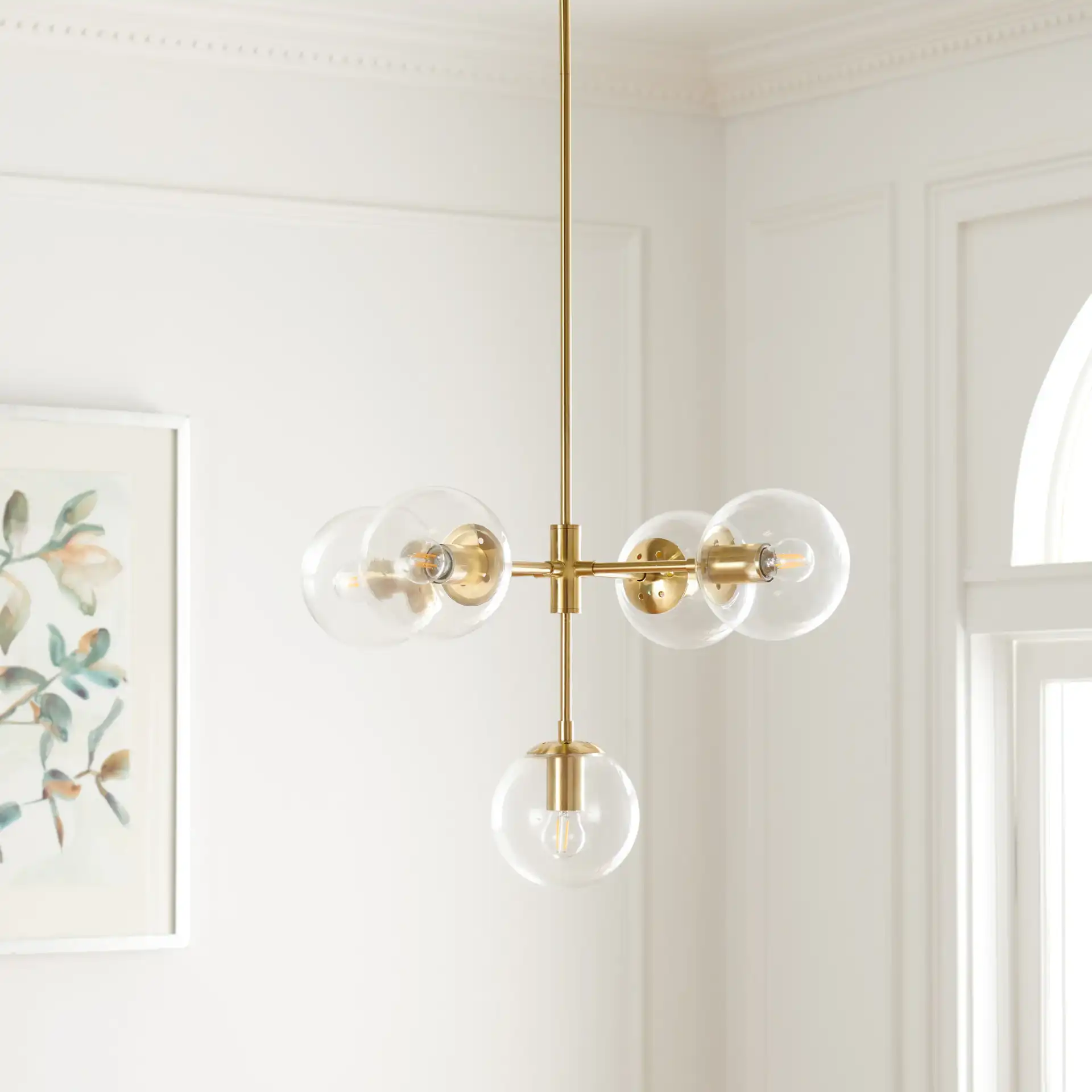 Camaria Five-Light Chandelier in Gold in a styled room