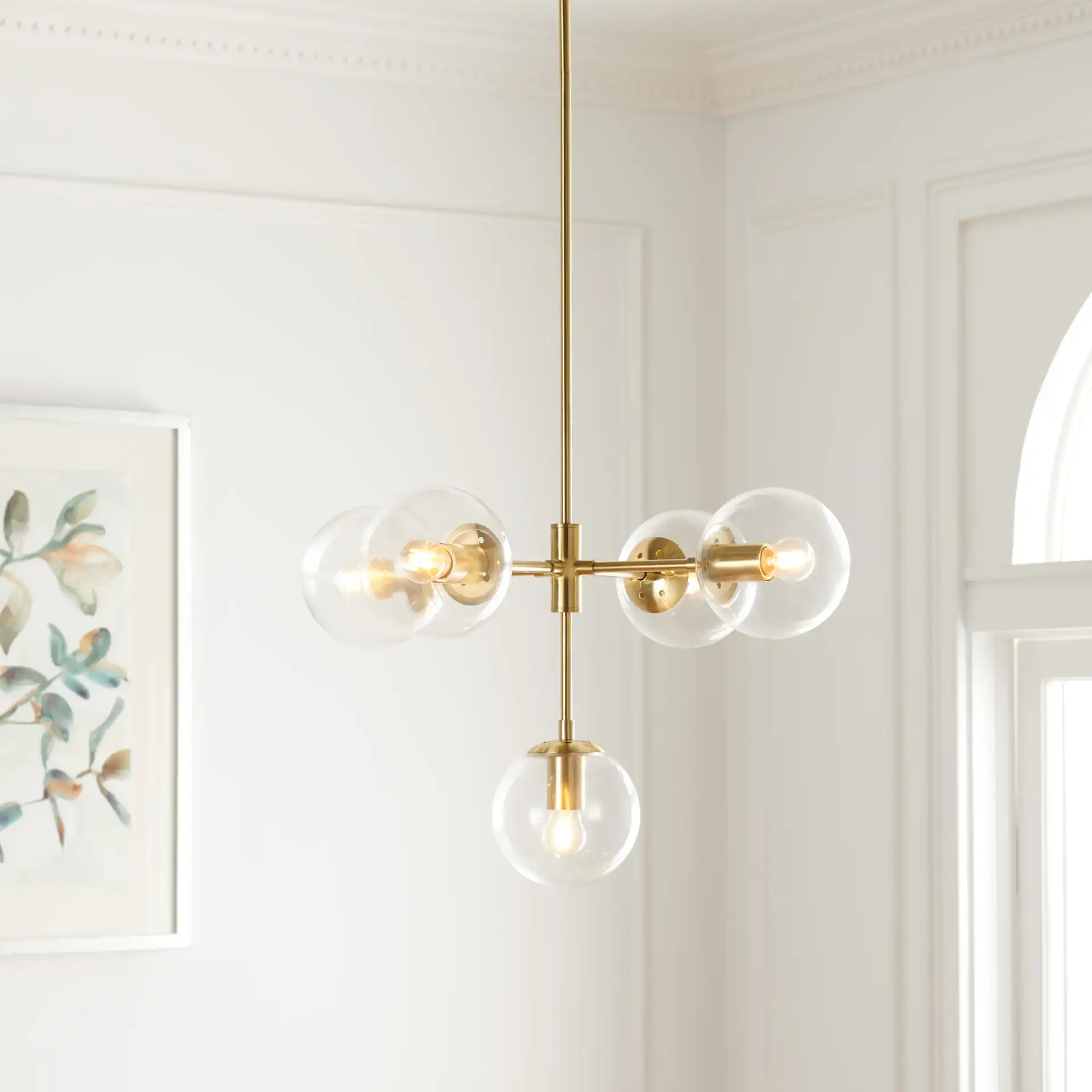 Camaria Five-Light Chandelier in Gold in a styled room