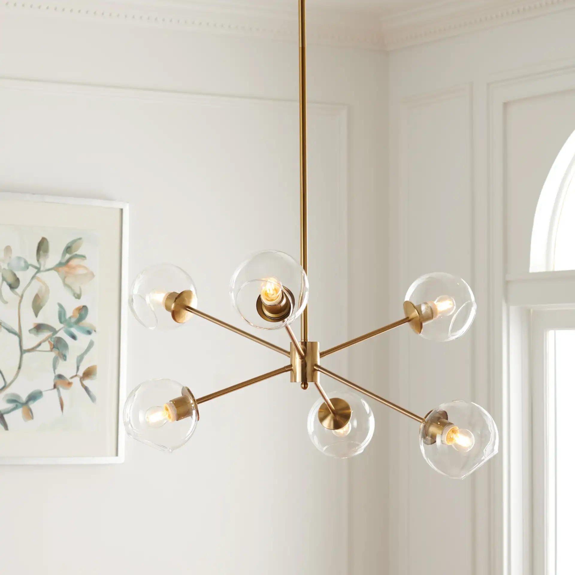 Cantori Six-Light Chandelier in Gold in a styled room
