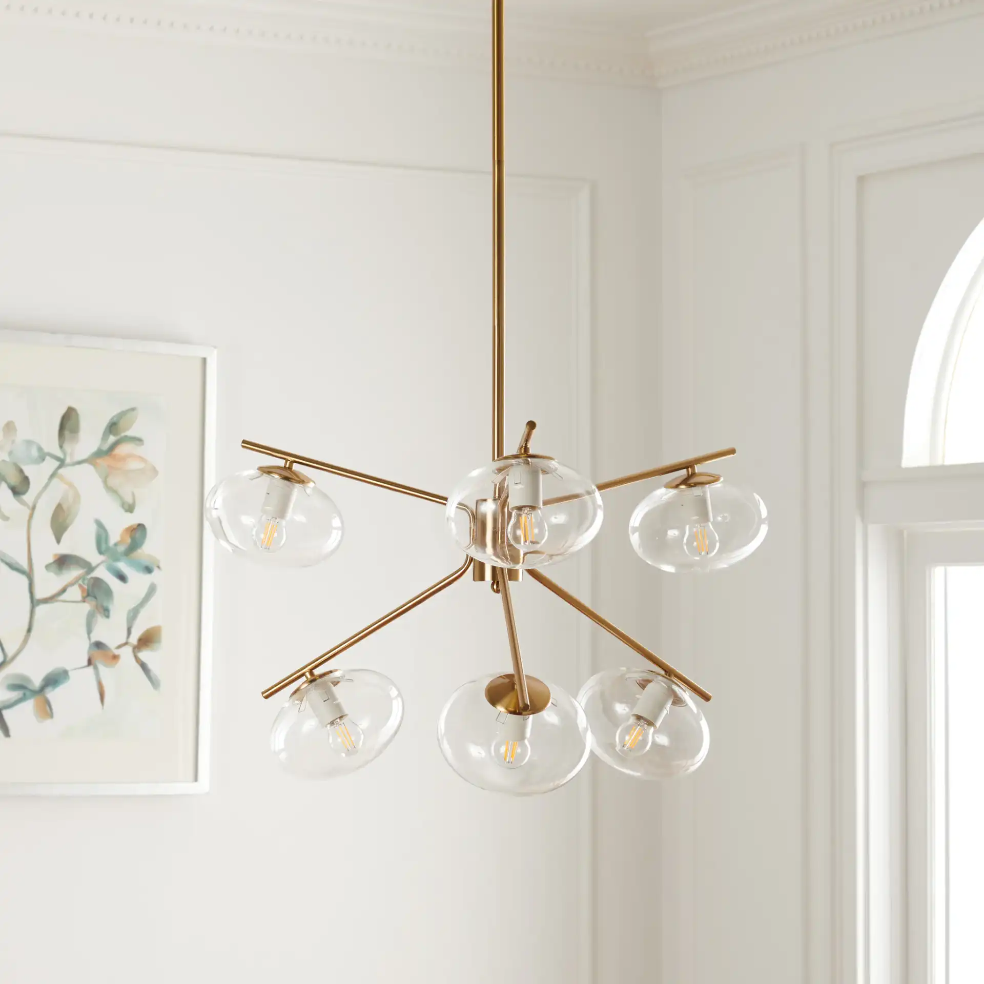 Bartoli Six-Light Chandelier in Brass in a styled room