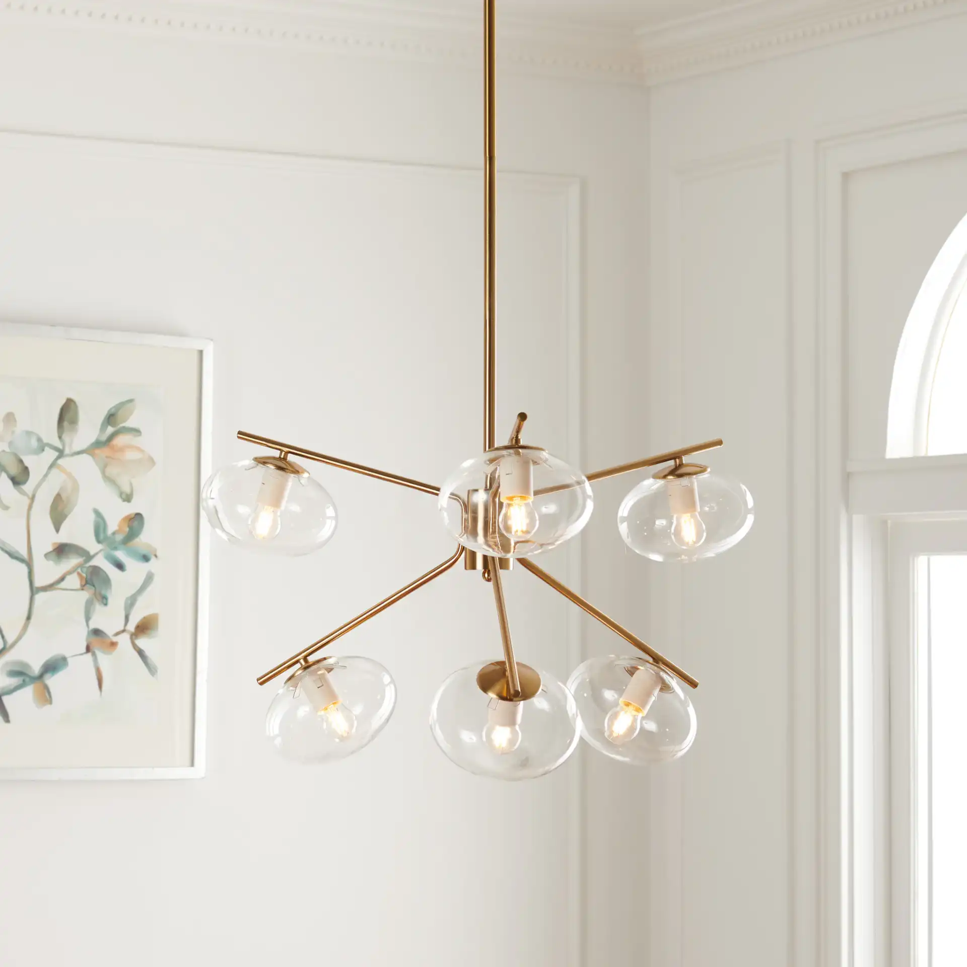 Bartoli Six-Light Chandelier in Brass in a styled room