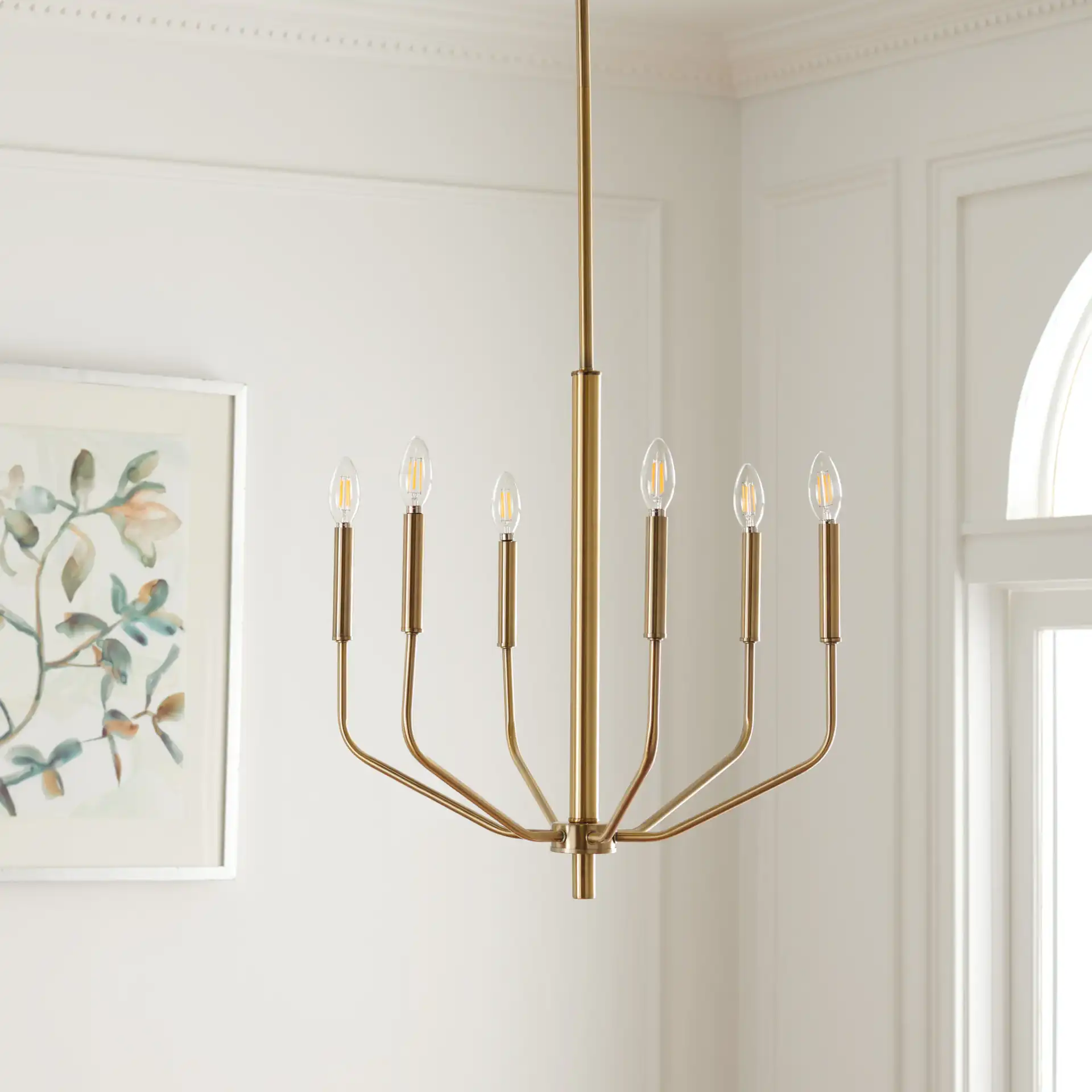 Eirene Chandelier in Antique Brass in a styled room