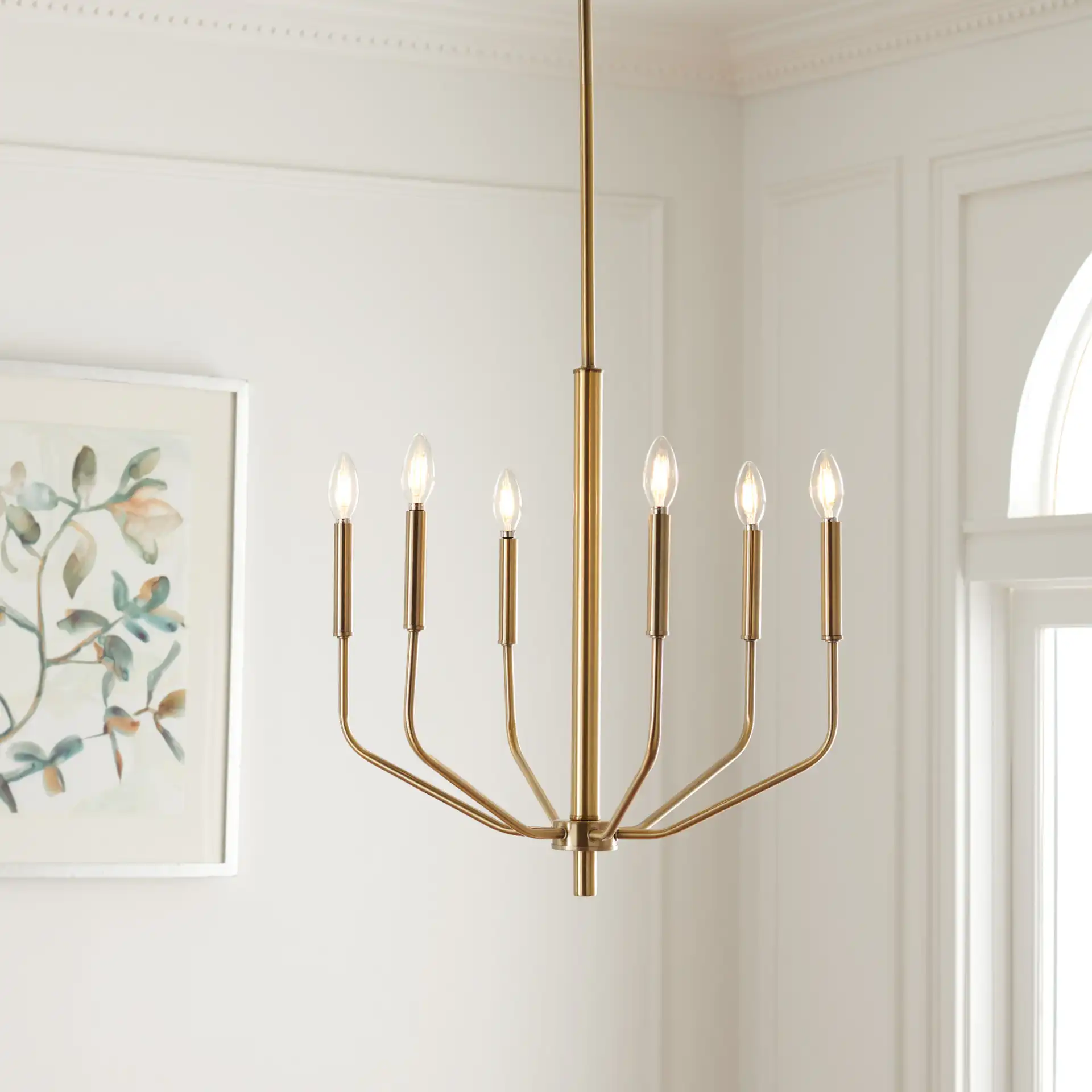 Eirene Chandelier in Antique Brass in a styled room