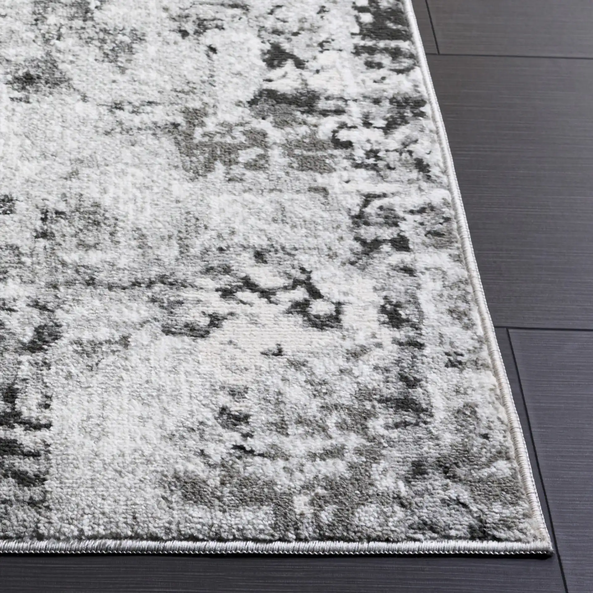 Chamber Abstract Rug in Gray / Dark Gray in a styled room