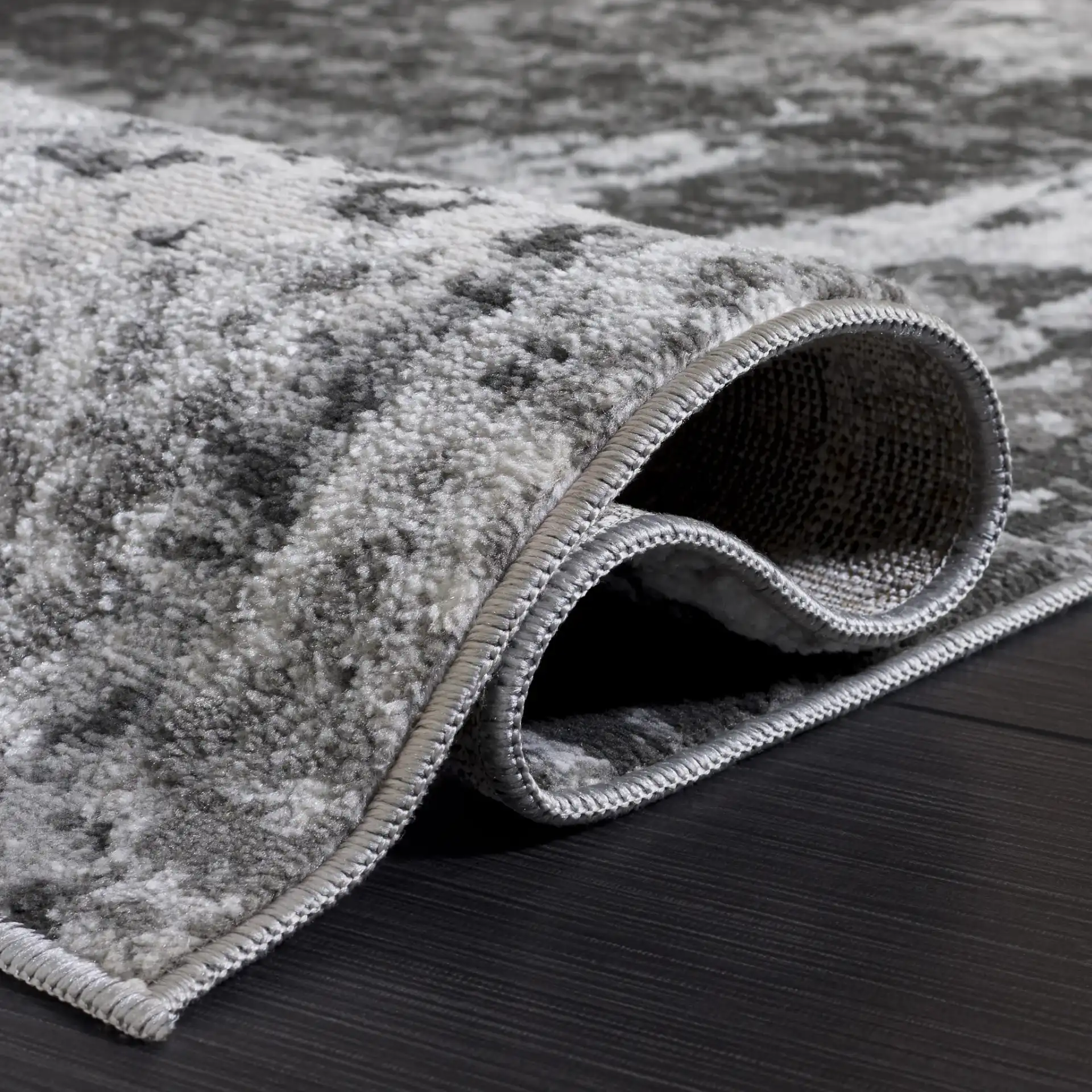Chamber Abstract Rug in Gray / Dark Gray in a styled room