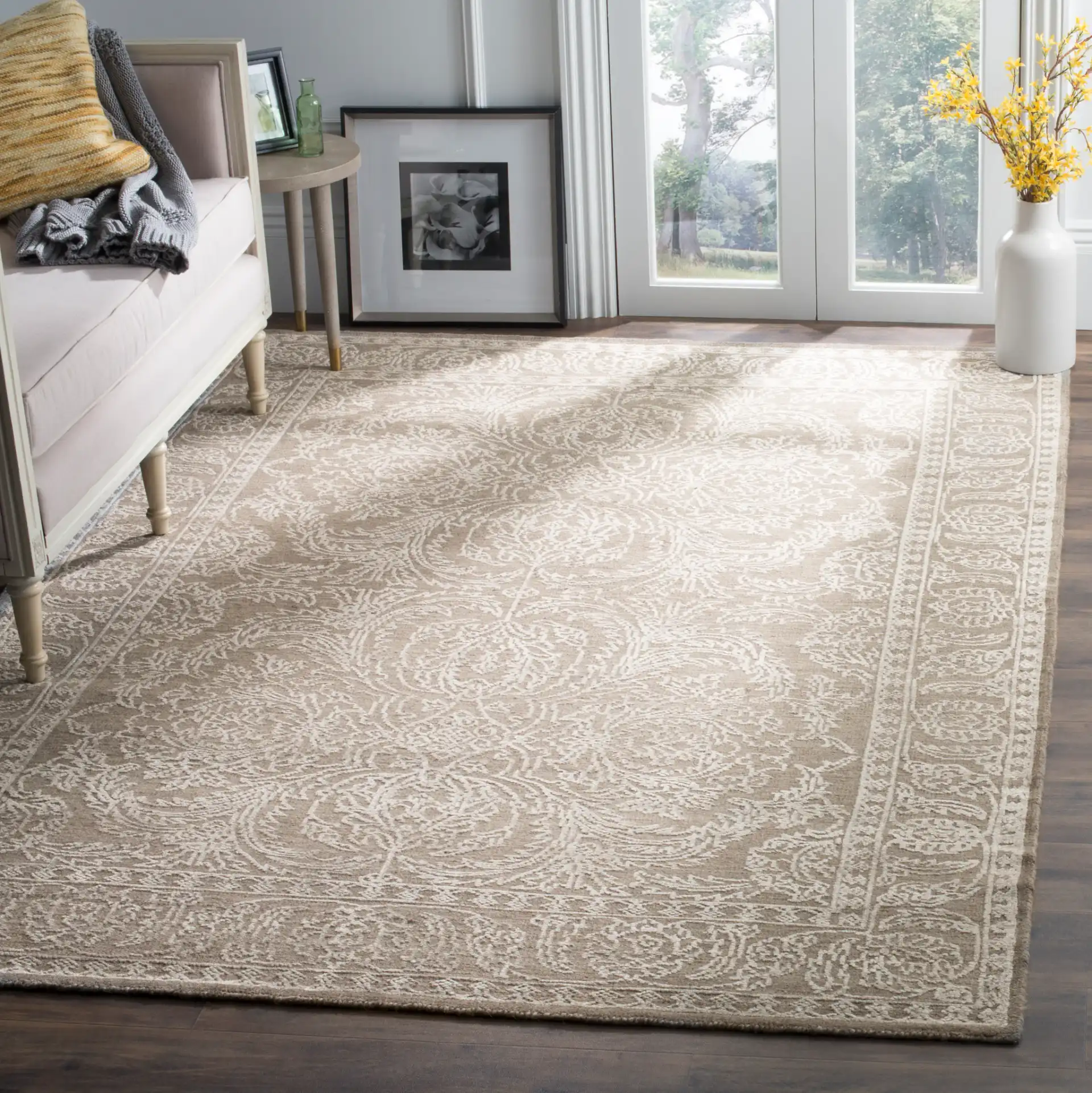Chester Floral Scroll Hand-Knotted Rug in Stone Gray / Pearl in a styled room