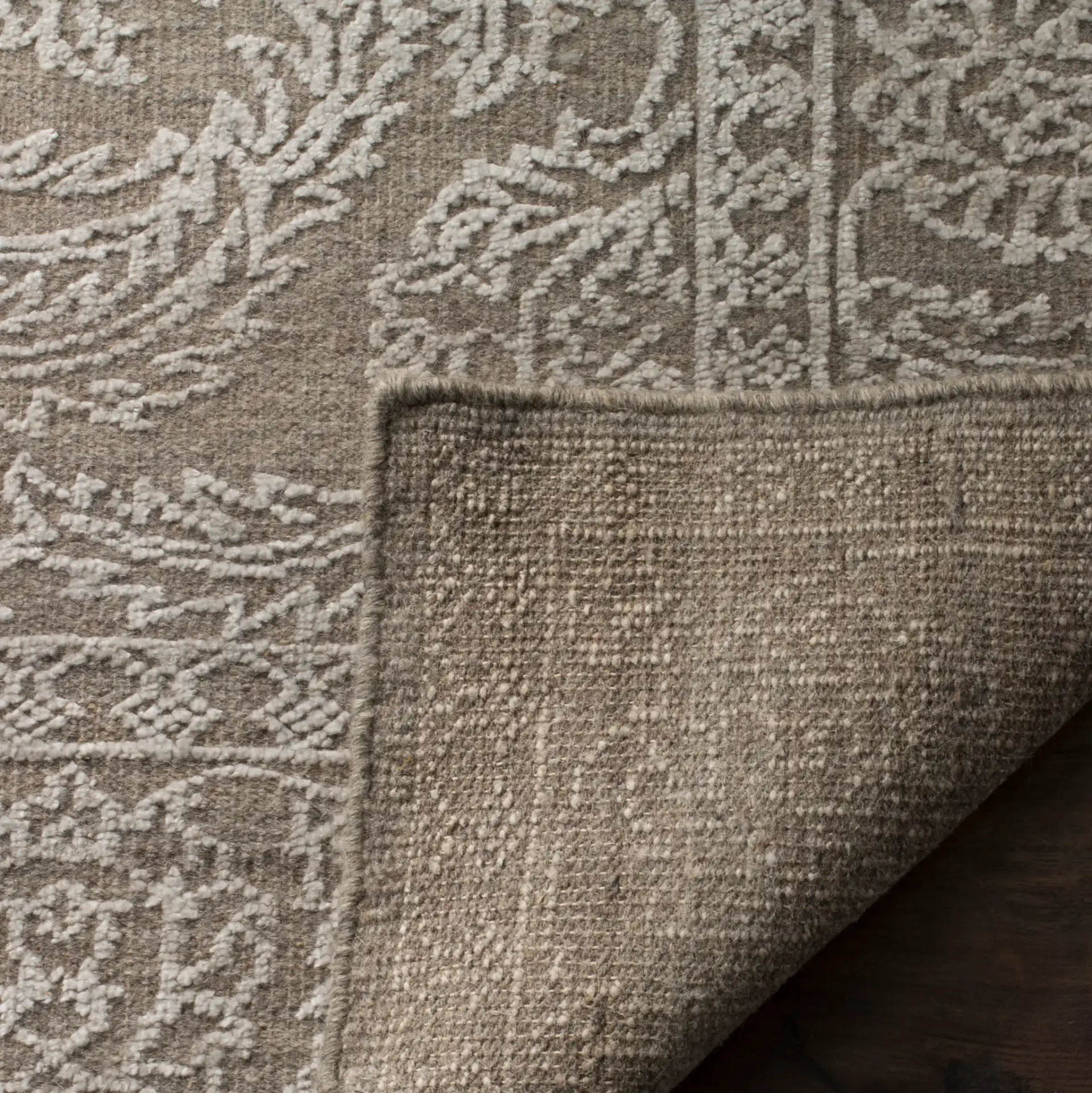 Chester Floral Scroll Hand-Knotted Rug in Stone Gray / Pearl in a styled room