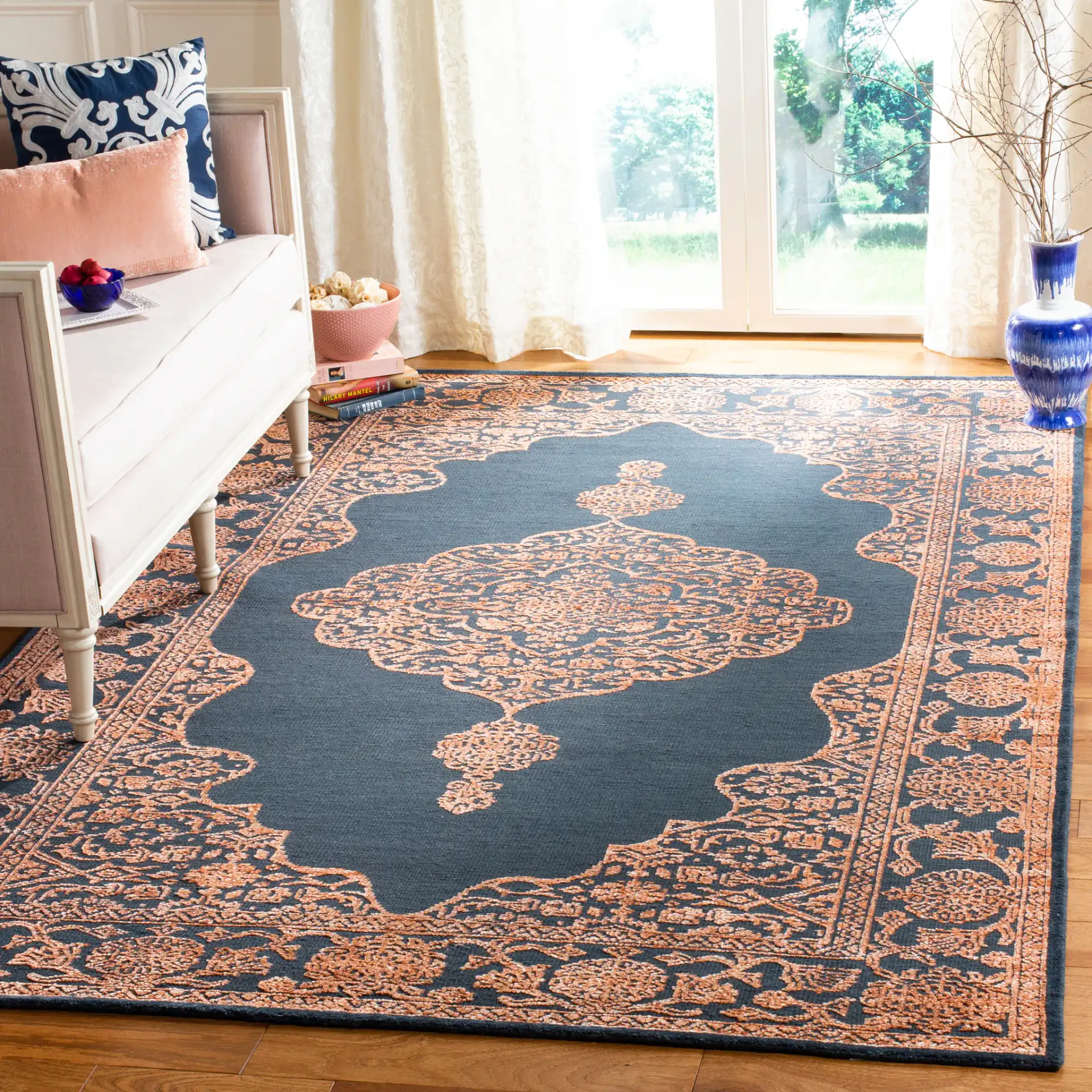 Chester Medallion Hand-Knotted Rug in Navy / Rust in a styled room
