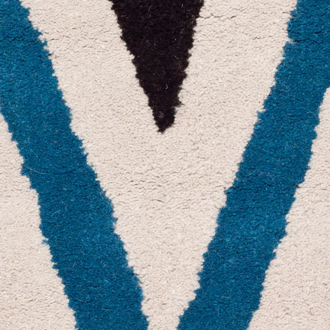Chatham Sharp Chevron Hand-Tufted Wool Rug in Ivory / Multicolor in a styled room
