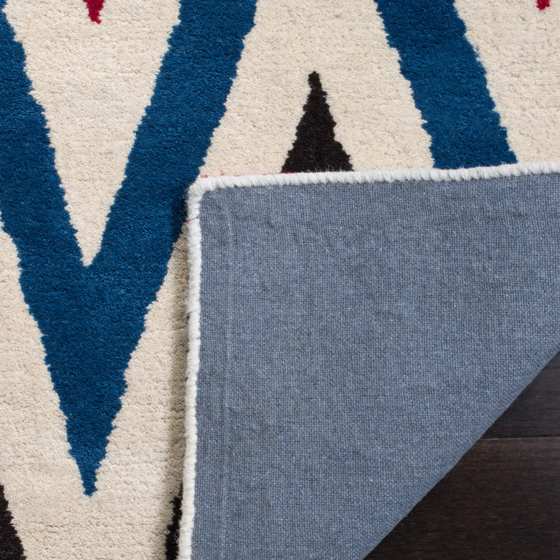 Chatham Sharp Chevron Hand-Tufted Wool Rug in Ivory / Multicolor in a styled room