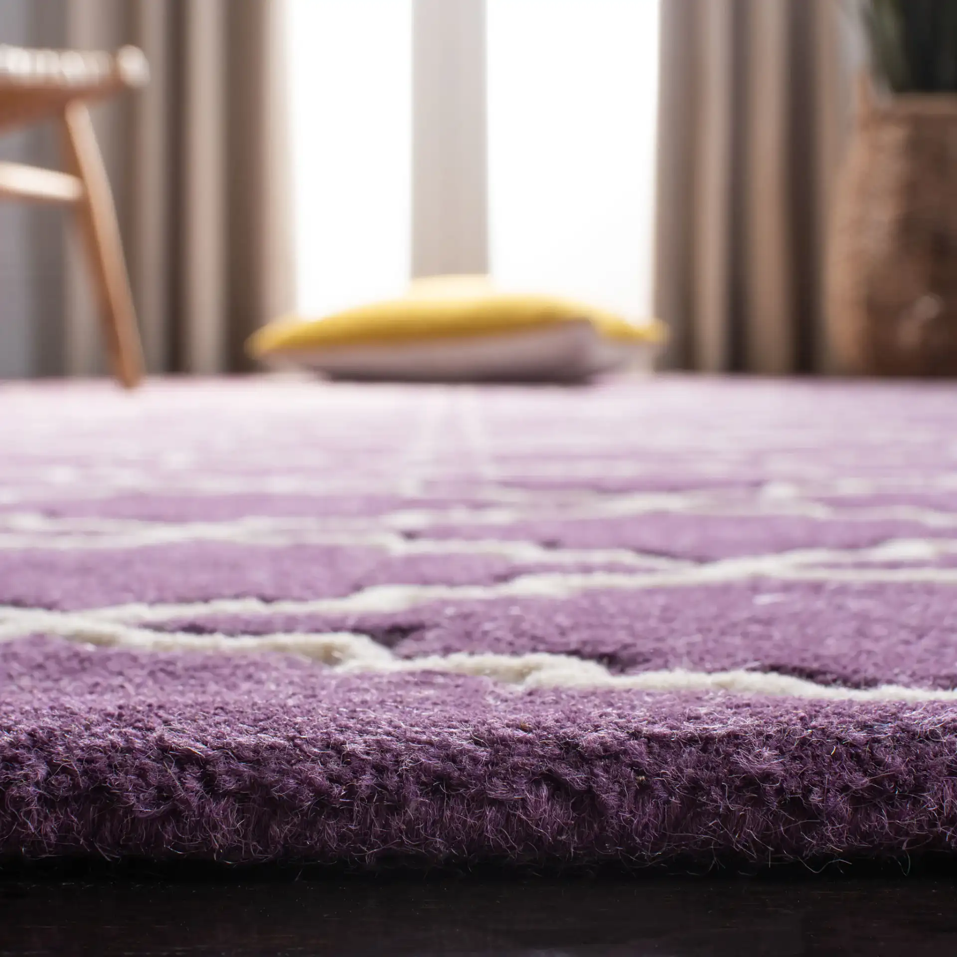 Chatham Stepped Trellis Hand-Tufted Wool Rug in Purple / Ivory in a styled room
