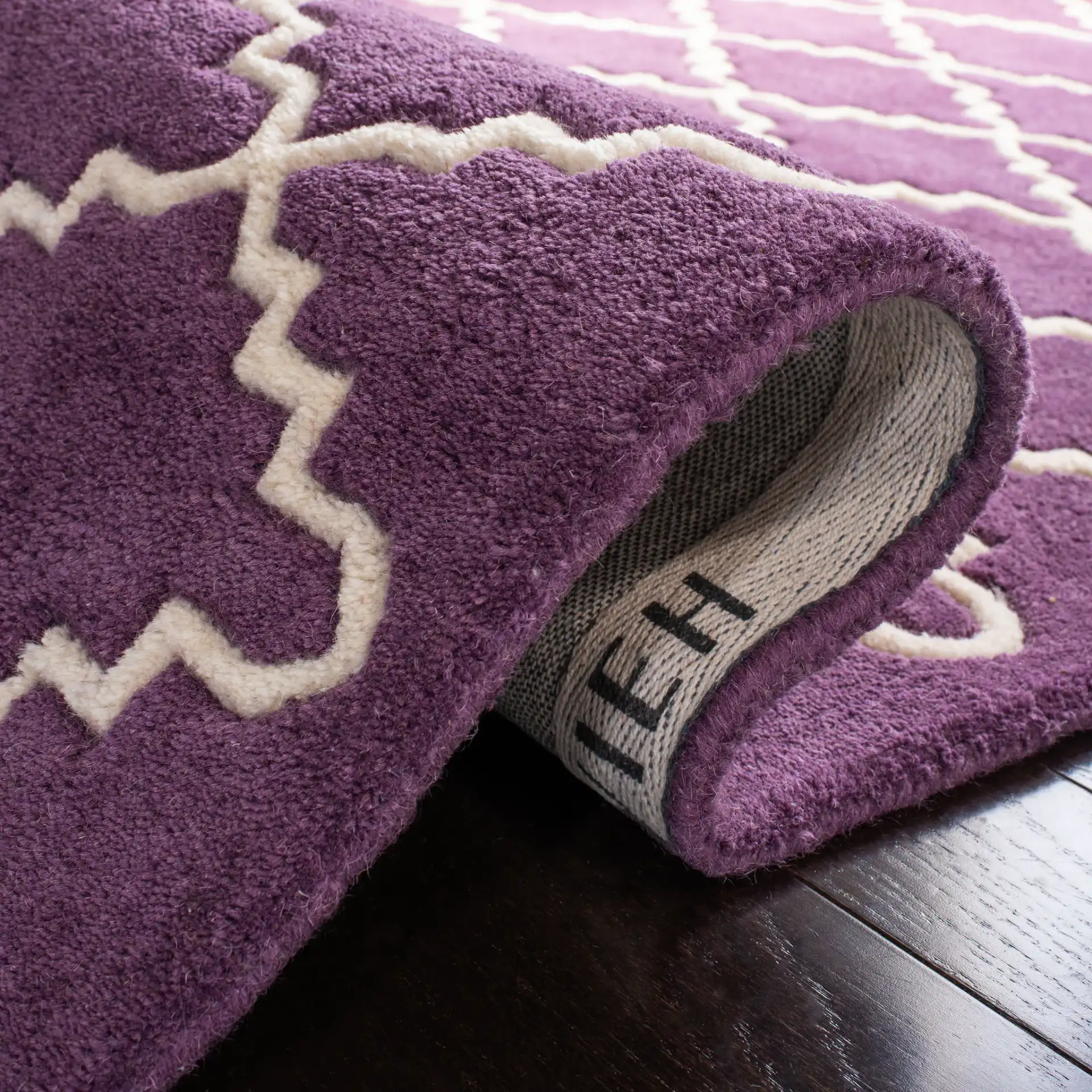 Chatham Stepped Trellis Hand-Tufted Wool Rug in Purple / Ivory in a styled room