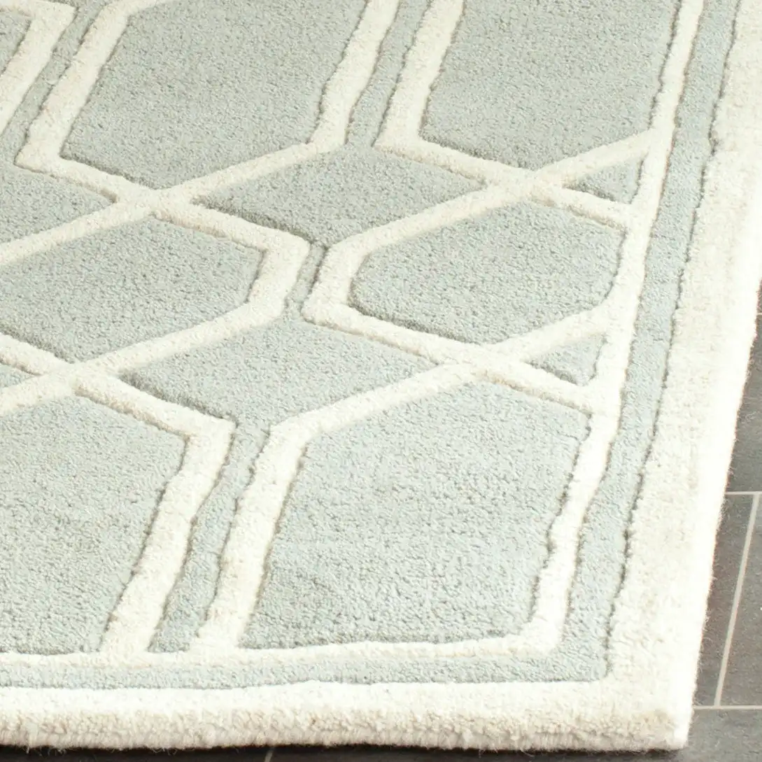 Chatham Bordered Hexagon Trellis Hand-Tufted Wool Rug in Gray / Ivory in a styled room