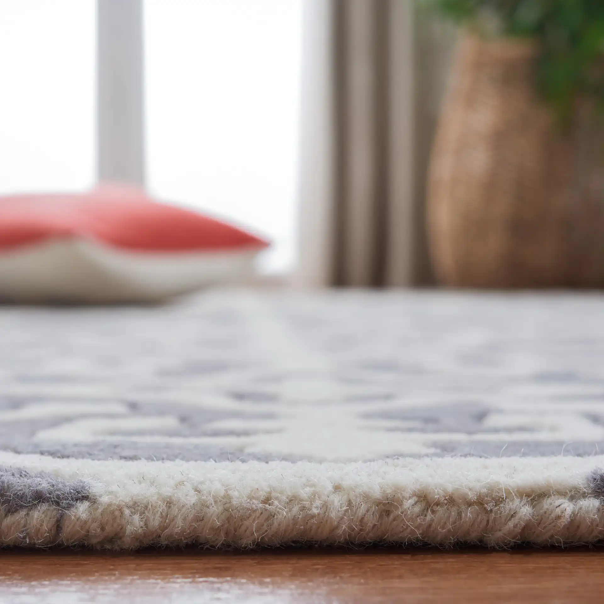 Chatham Tile Trellis Hand-Tufted Wool Rug in Dark Gray / Ivory in a styled room