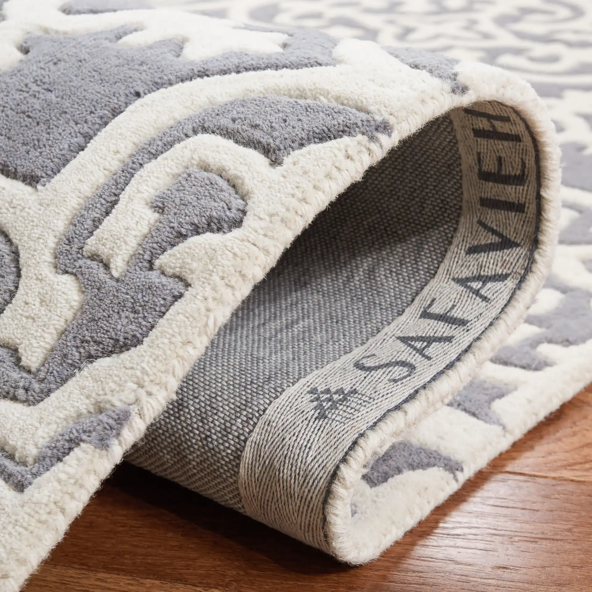 Chatham Tile Trellis Hand-Tufted Wool Rug in Dark Gray / Ivory in a styled room