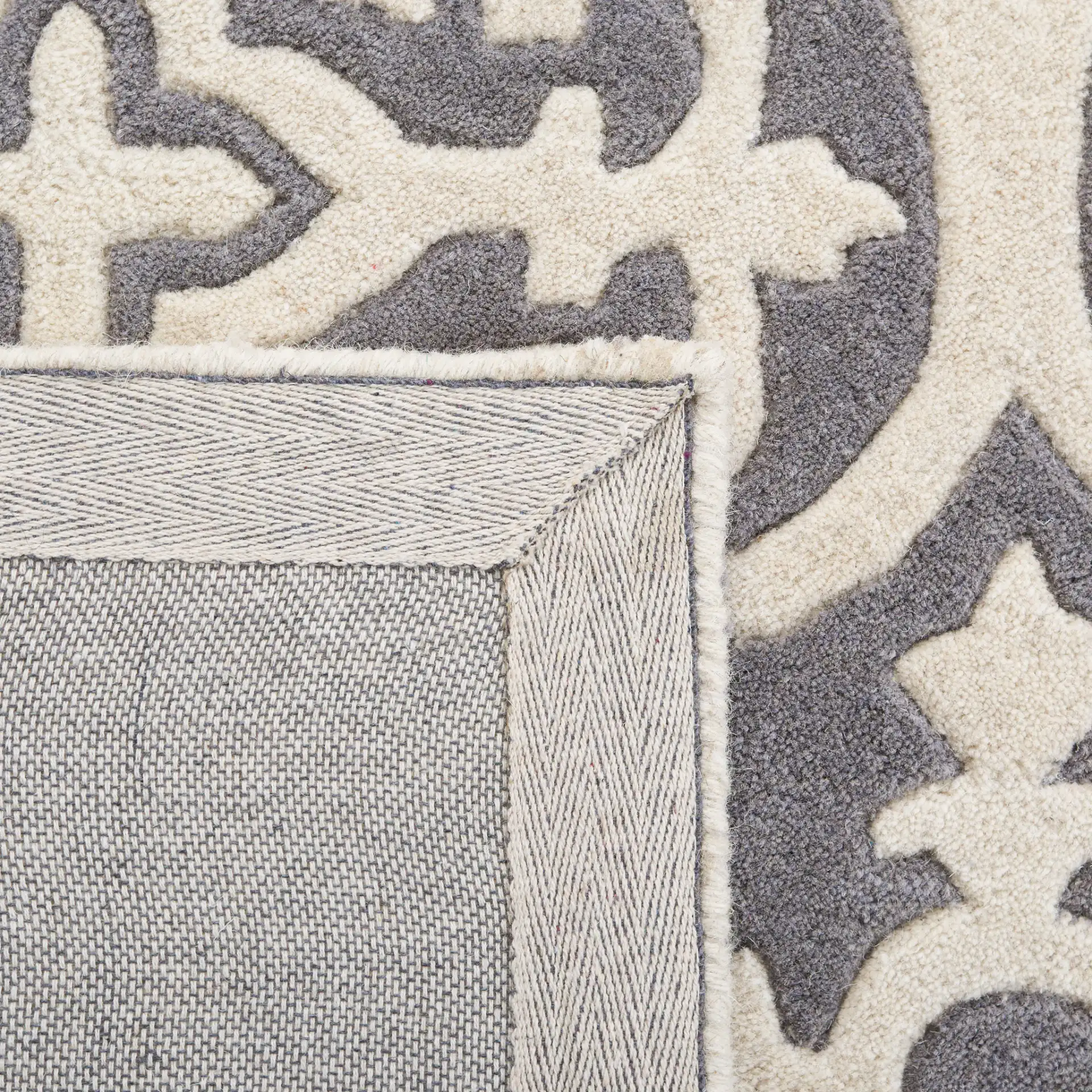 Chatham Tile Trellis Hand-Tufted Wool Rug in Dark Gray / Ivory in a styled room