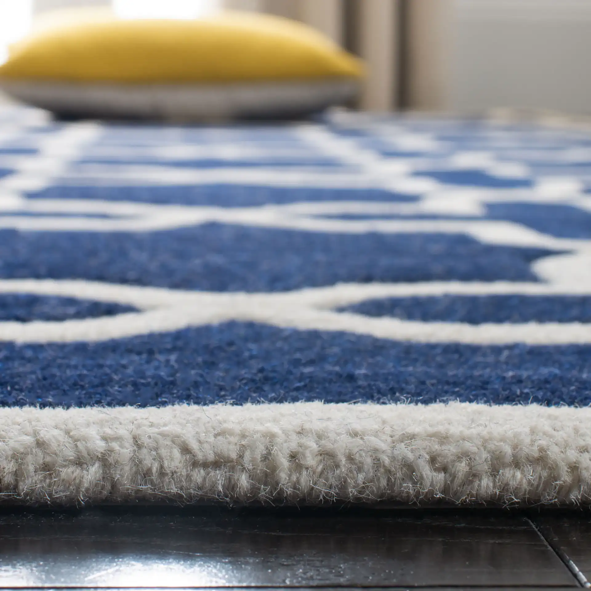 Chatham Star Lattice Hand-Tufted Wool Rug in Dark Blue / Ivory in a styled room
