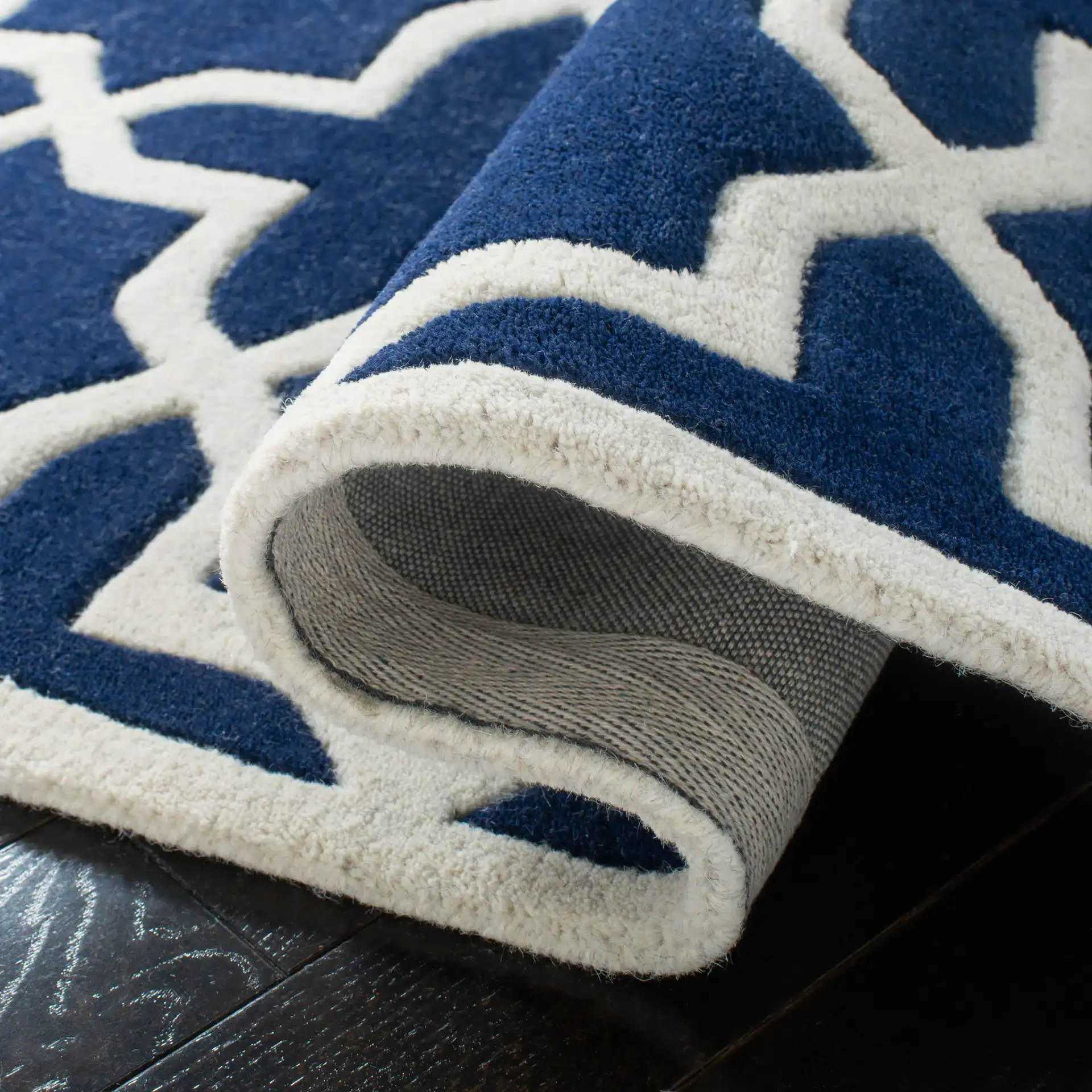 Chatham Star Lattice Hand-Tufted Wool Rug in Dark Blue / Ivory in a styled room