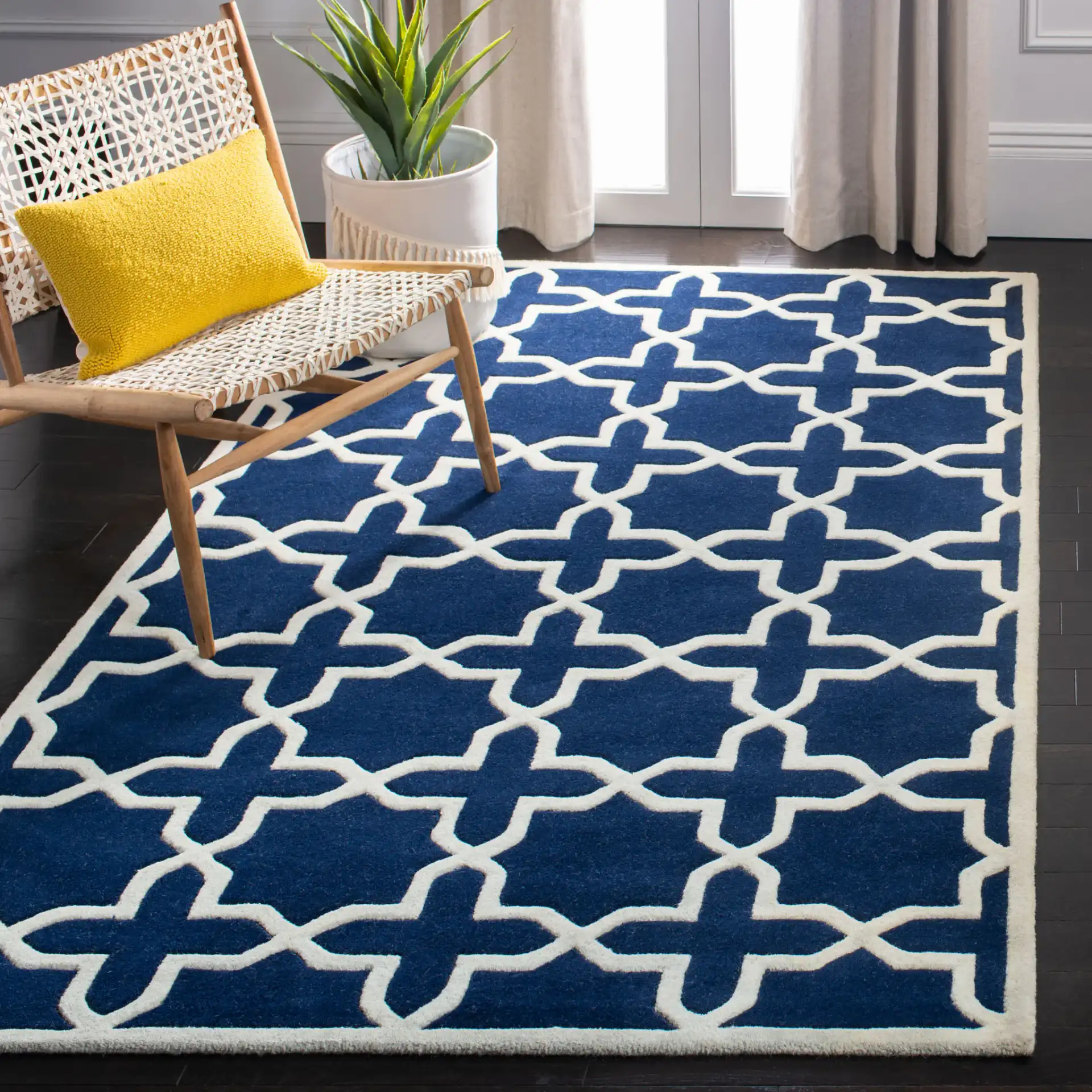 Chatham Star Lattice Hand-Tufted Wool Rug in Dark Blue / Ivory in a styled room