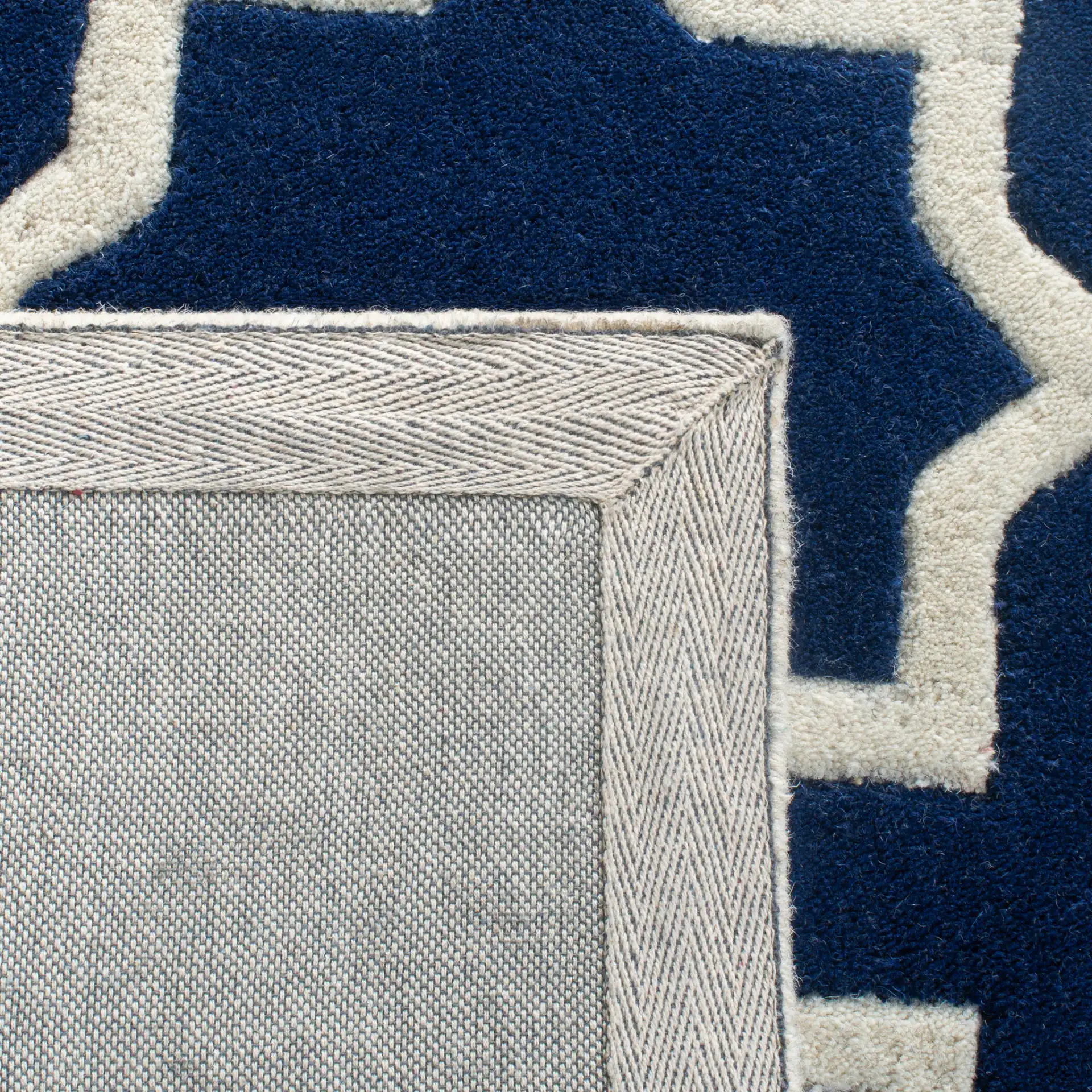 Chatham Star Lattice Hand-Tufted Wool Rug in Dark Blue / Ivory in a styled room