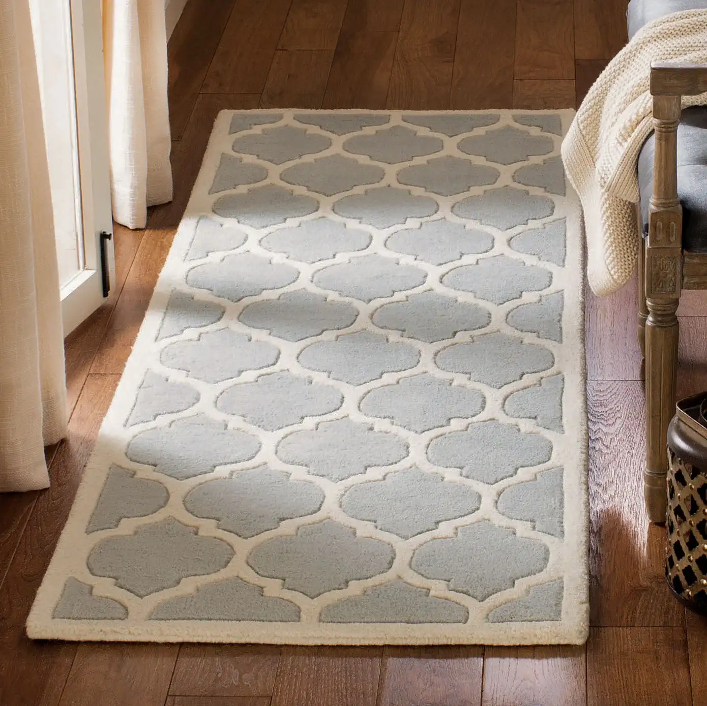 Chatham Lantern Trellis Hand-Tufted Wool Rug in Gray / Ivory in a styled room