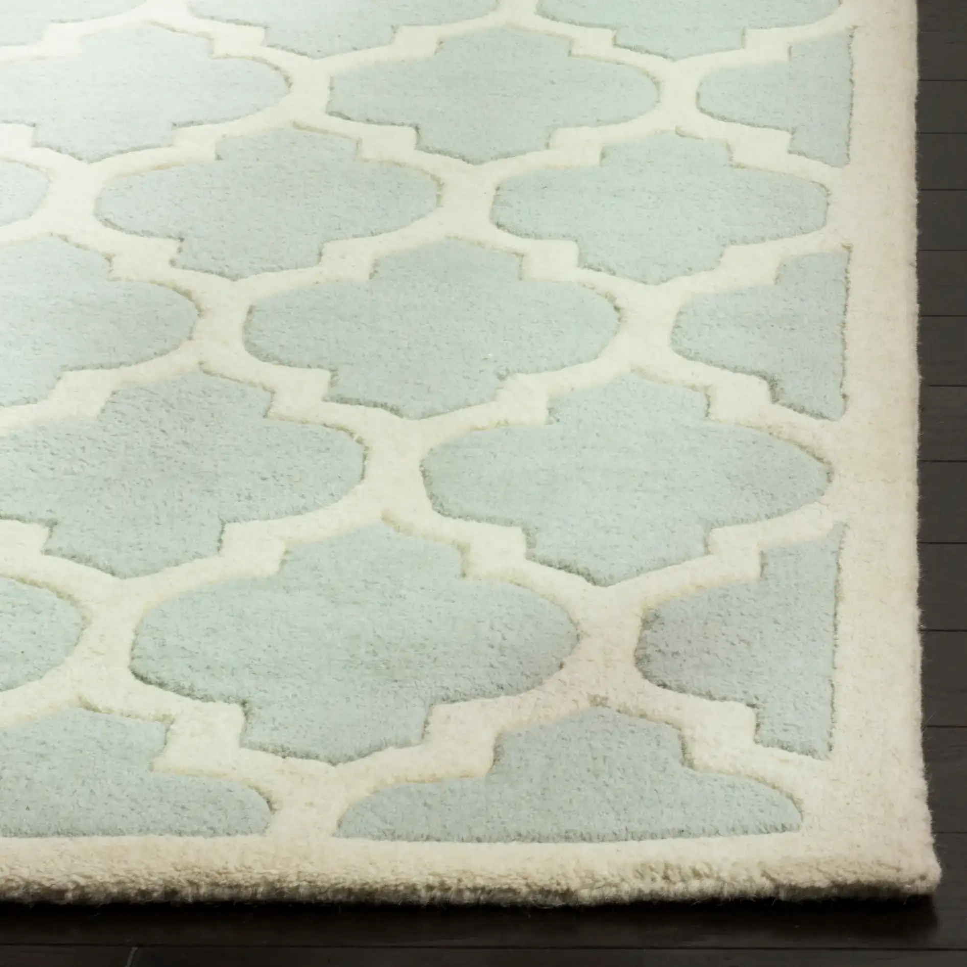 Chatham Lantern Trellis Hand-Tufted Wool Rug in Gray / Ivory in a styled room