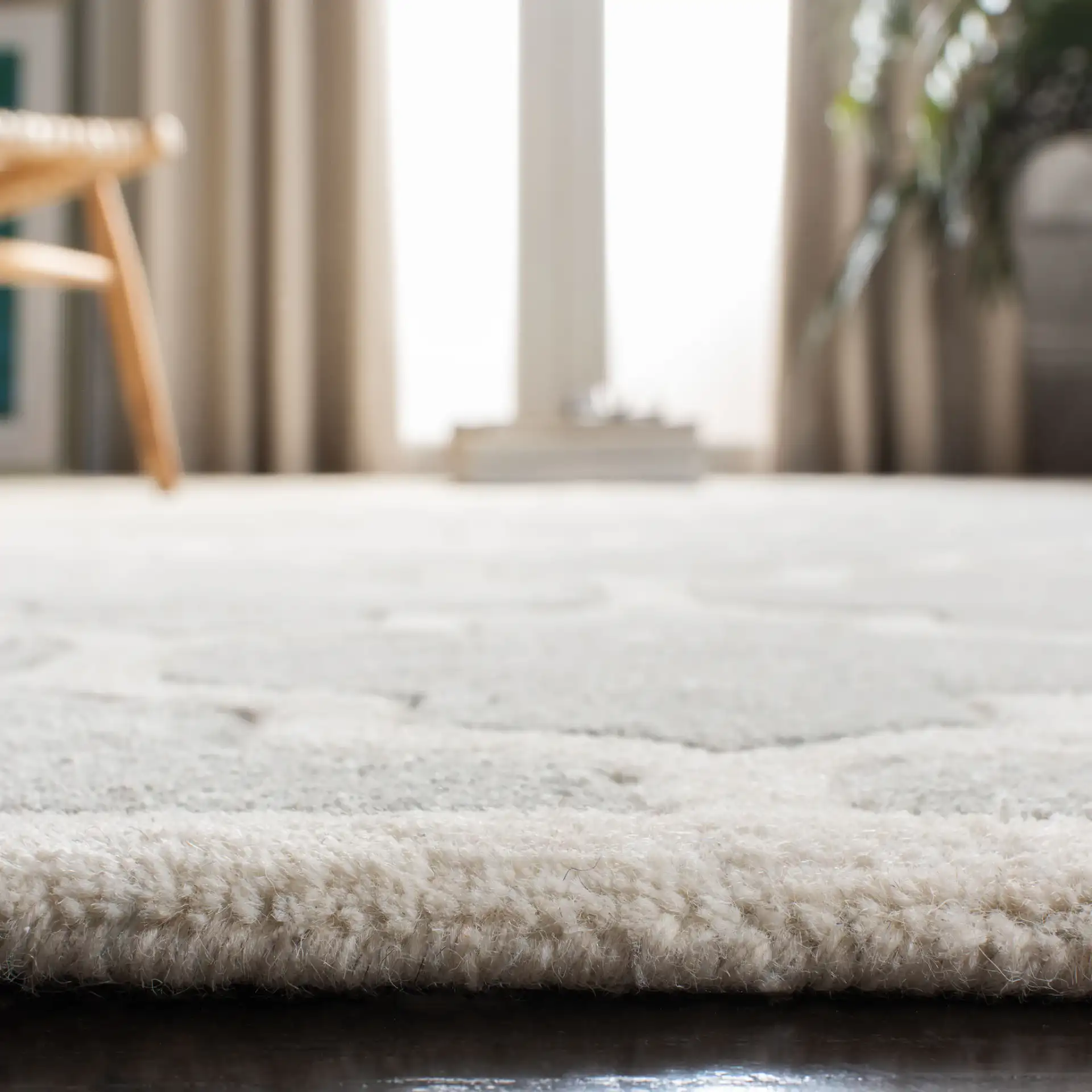 Chatham Lantern Trellis Hand-Tufted Wool Rug in Gray / Ivory in a styled room