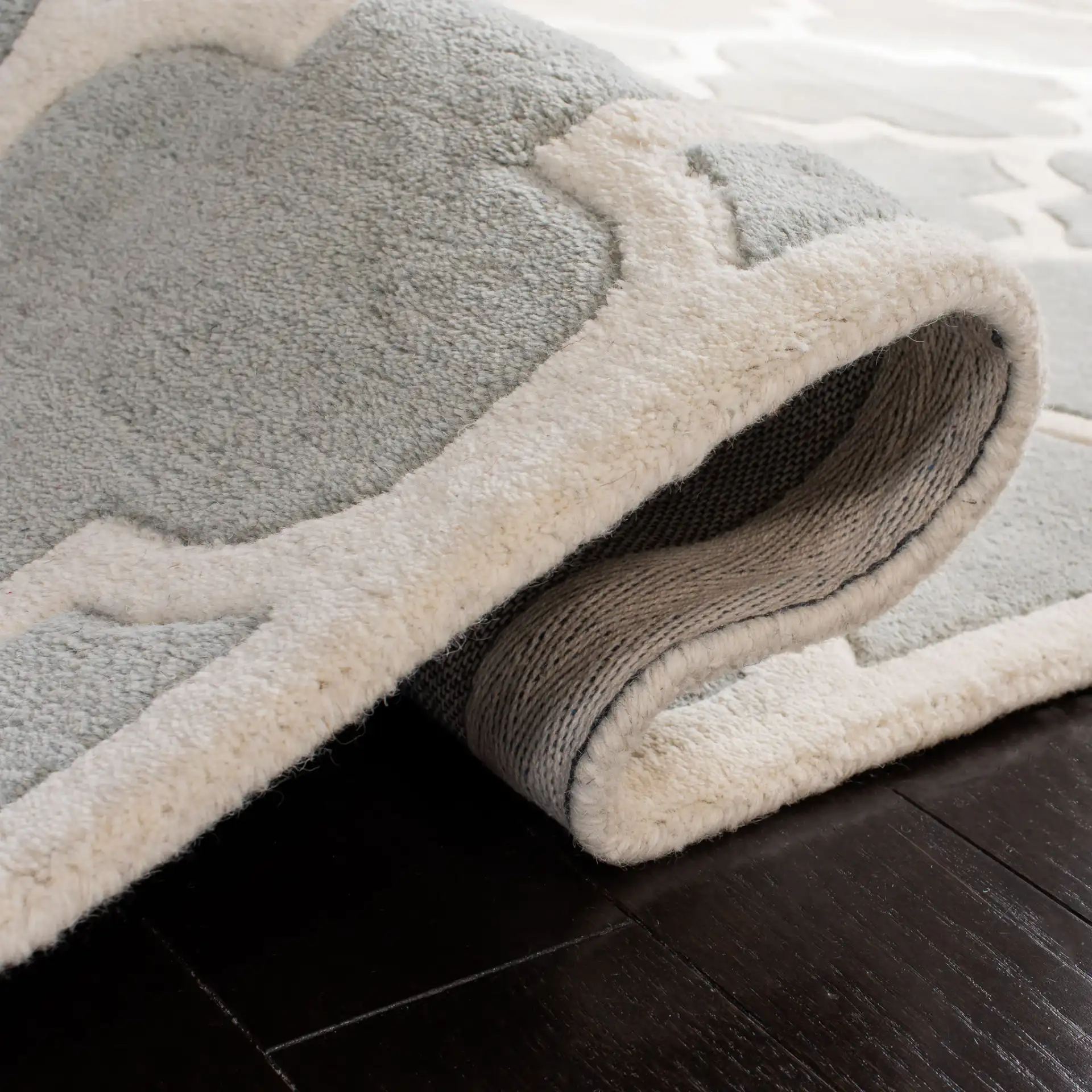 Chatham Lantern Trellis Hand-Tufted Wool Rug in Gray / Ivory in a styled room