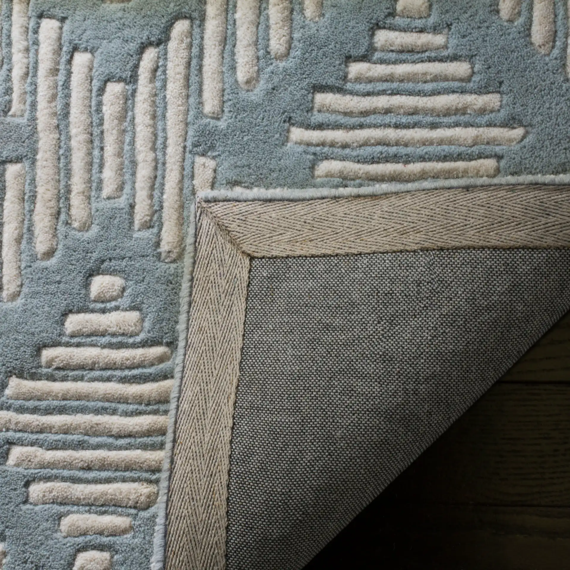 Chatham Dashed Diamond Hand-Tufted Wool Rug in Gray / Ivory in a styled room
