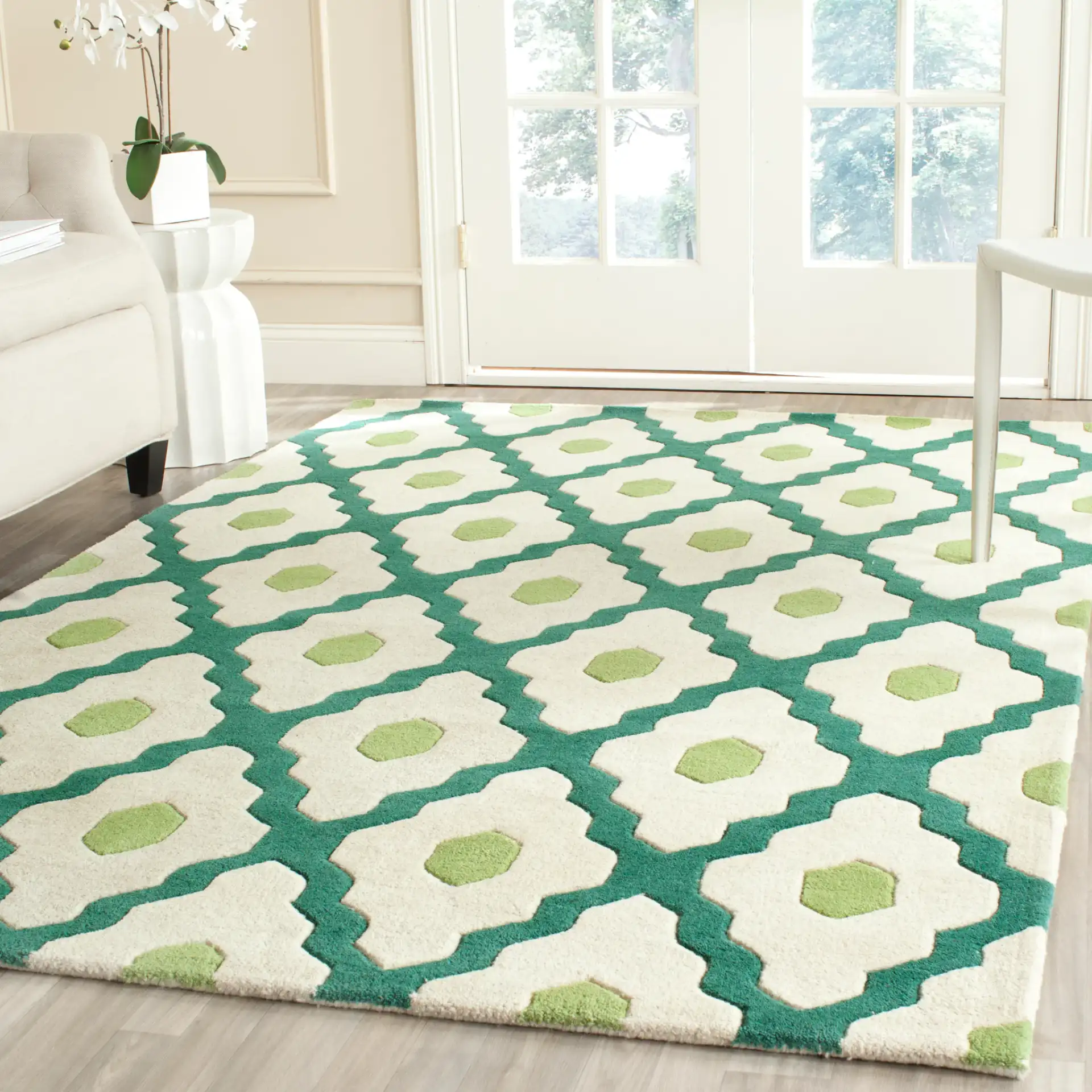 Chatham Ogee Hand-Tufted Wool Rug in Ivory / Teal in a styled room