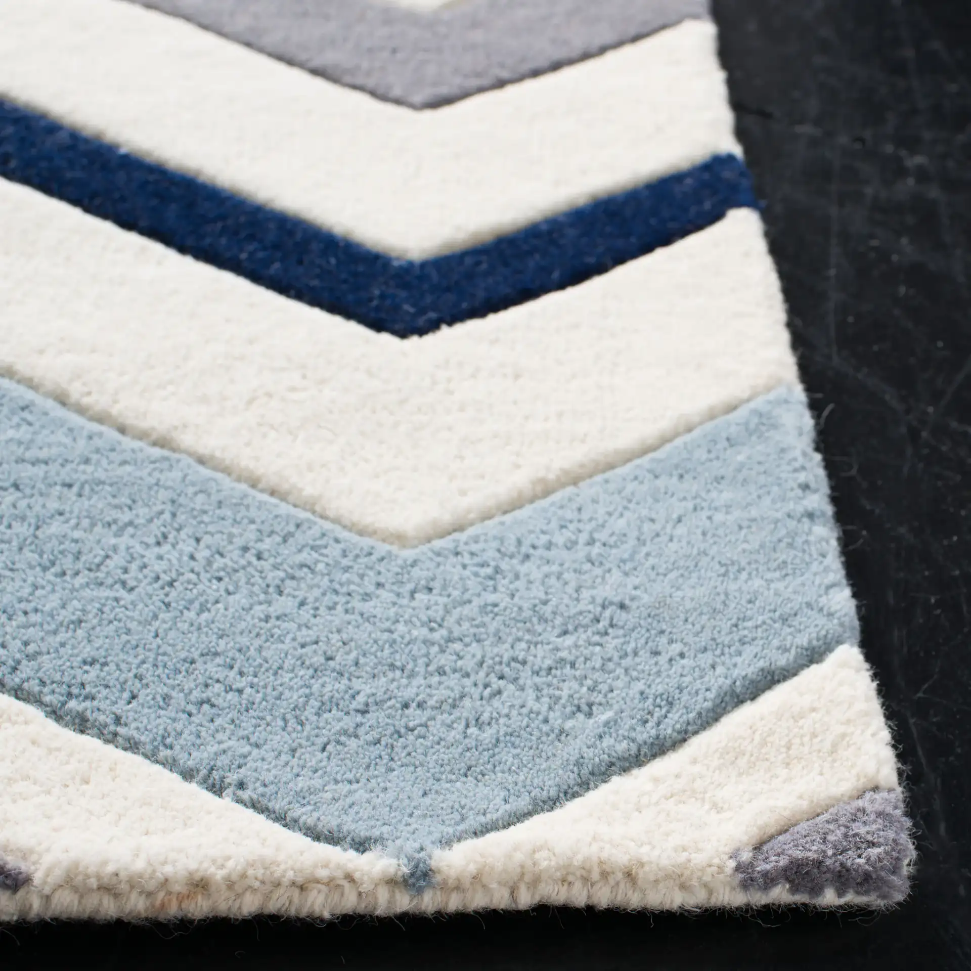Chatham Wide Chevron Hand-Tufted Wool Rug in Ivory / Dark Gray in a styled room