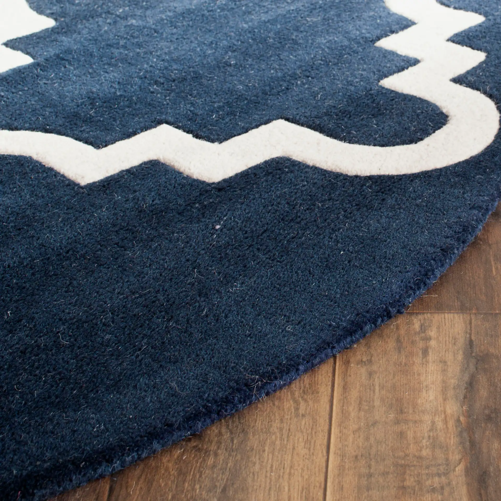 Chatham Large Stepped Trellis Hand-Tufted Wool Rug in Dark Blue / Ivory in a styled room