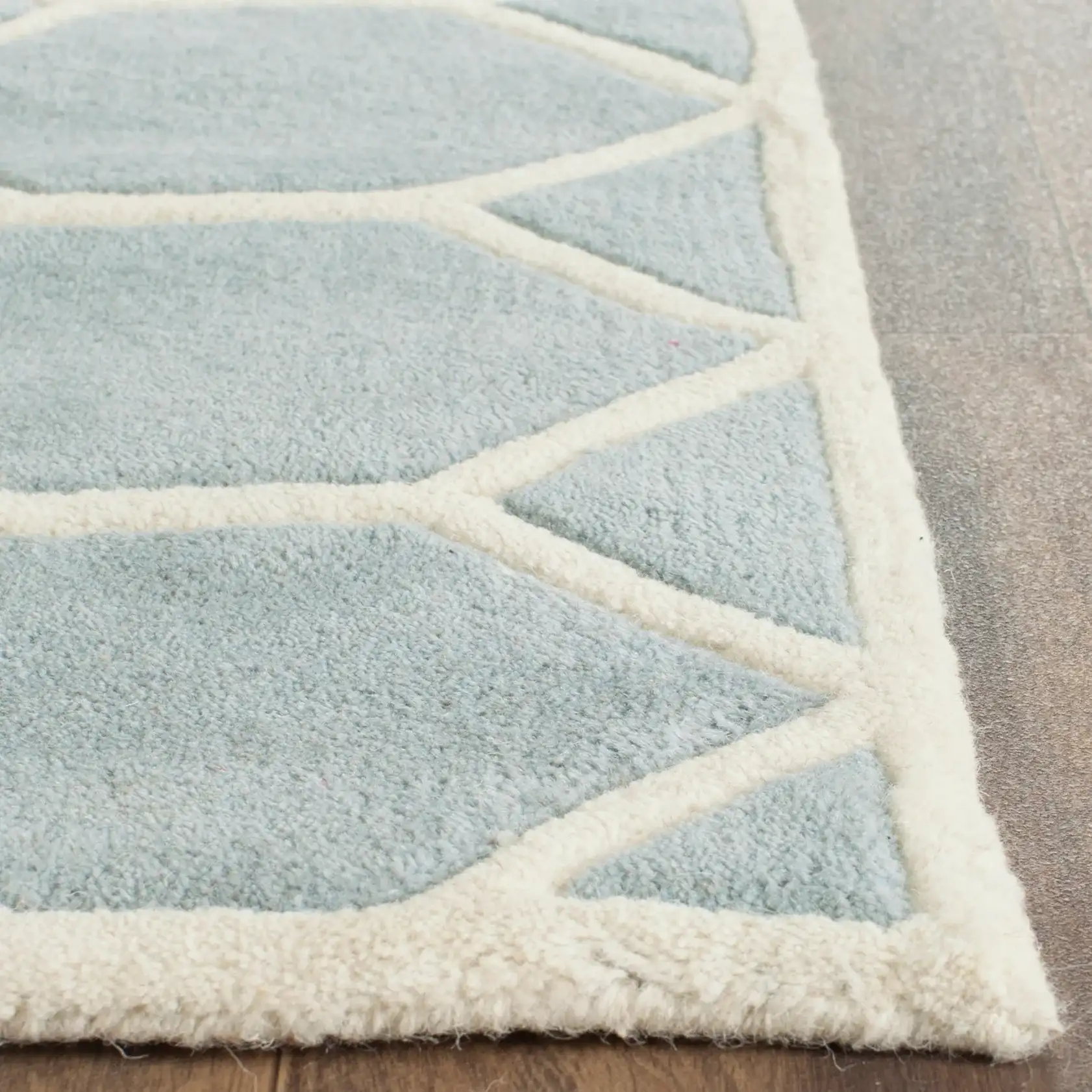 Chatham Honeycomb Lattice Hand-Tufted Wool Rug in Blue / Ivory in a styled room