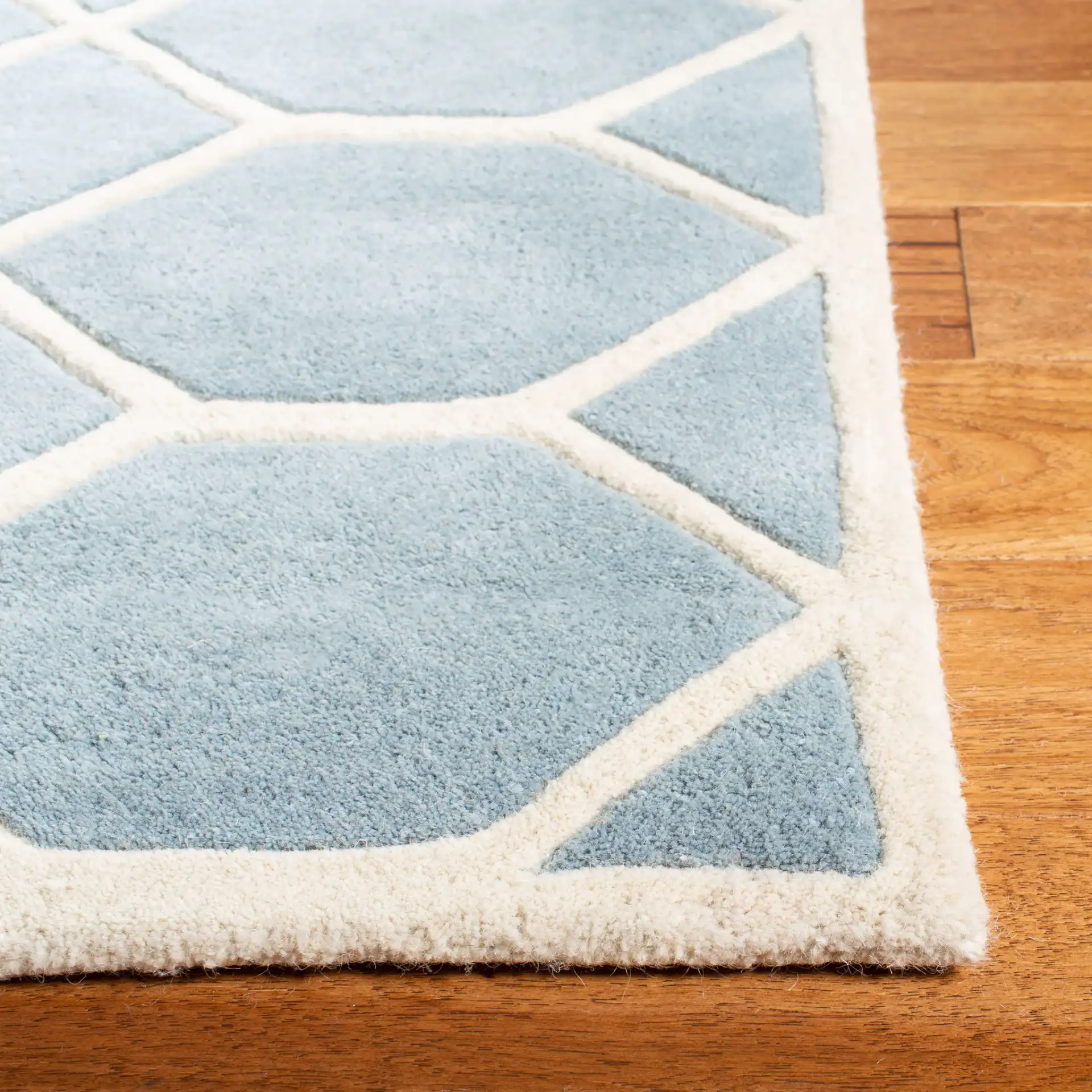 Chatham Honeycomb Lattice Hand-Tufted Wool Rug in Blue / Ivory in a styled room