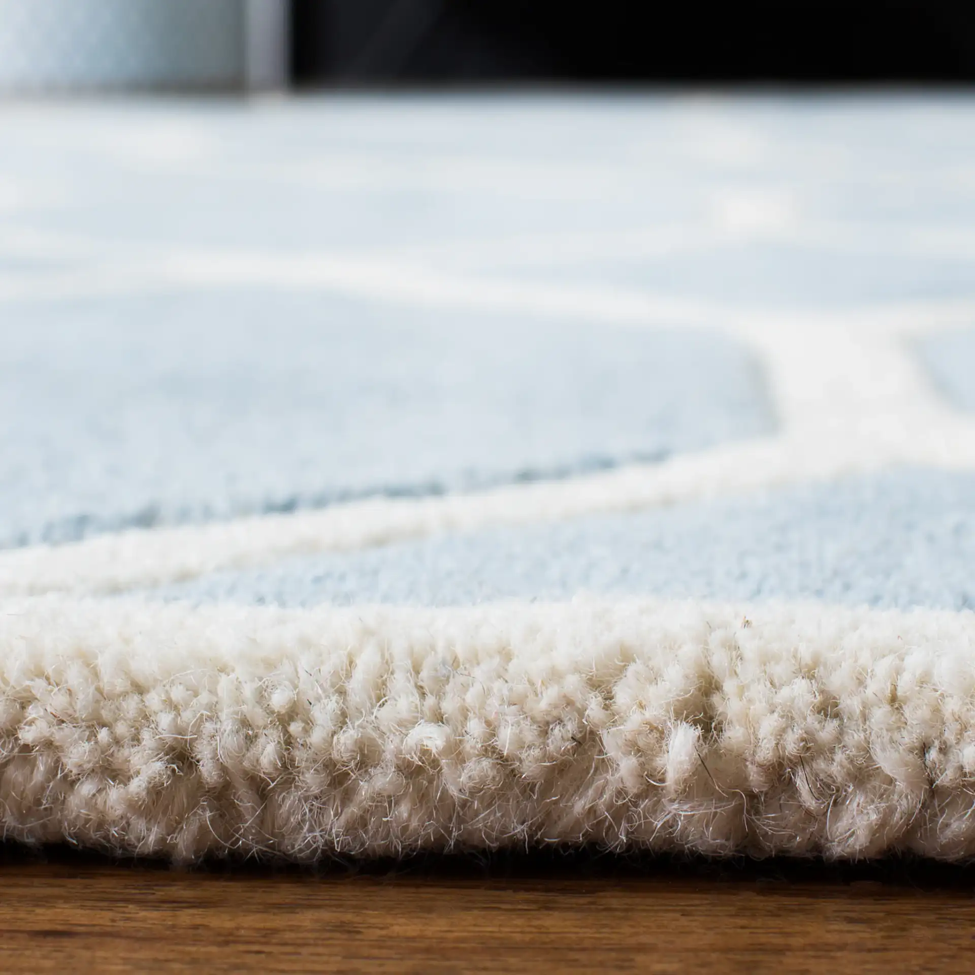 Chatham Honeycomb Lattice Hand-Tufted Wool Rug in Blue / Ivory in a styled room