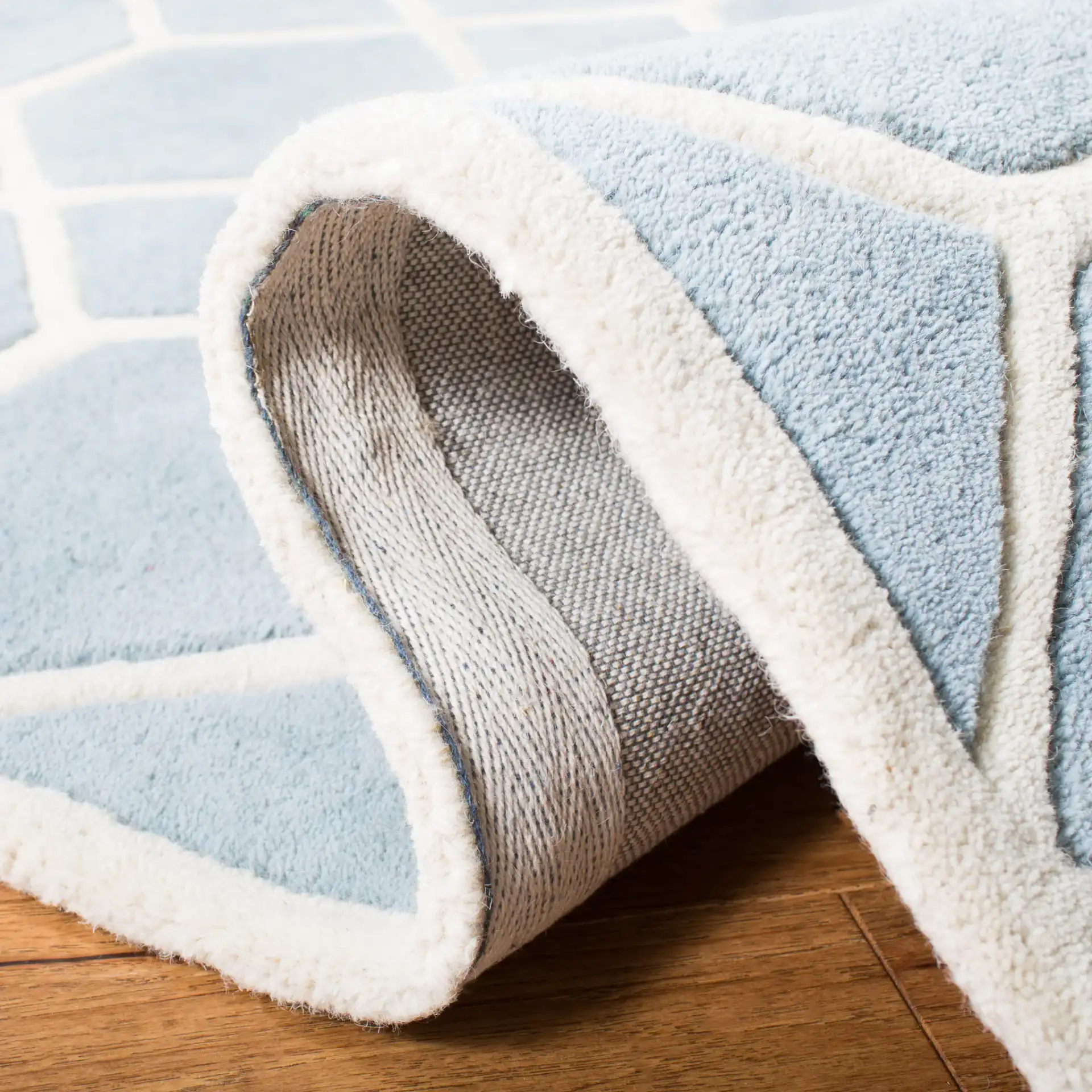 Chatham Honeycomb Lattice Hand-Tufted Wool Rug in Blue / Ivory in a styled room
