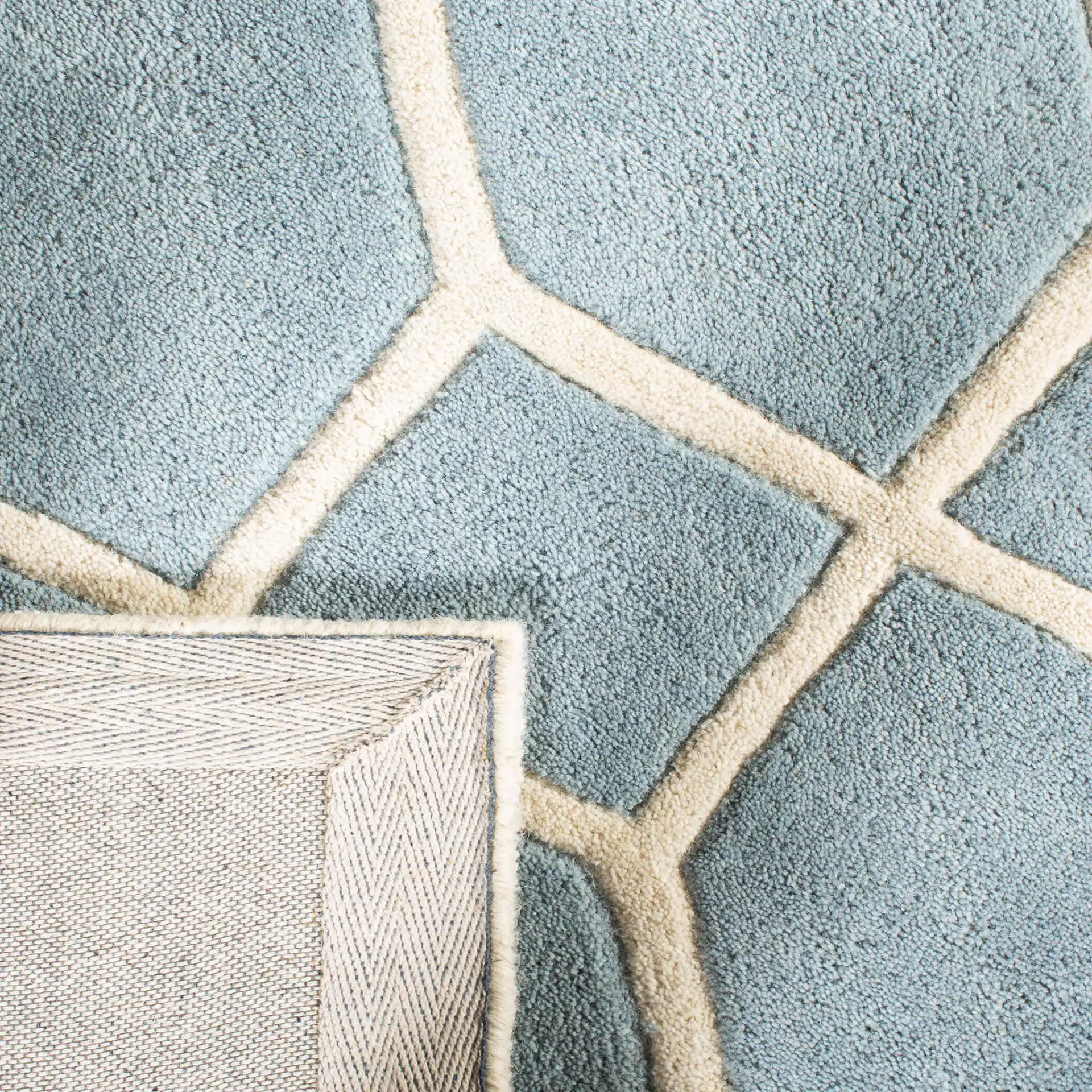 Chatham Honeycomb Lattice Hand-Tufted Wool Rug in Blue / Ivory in a styled room