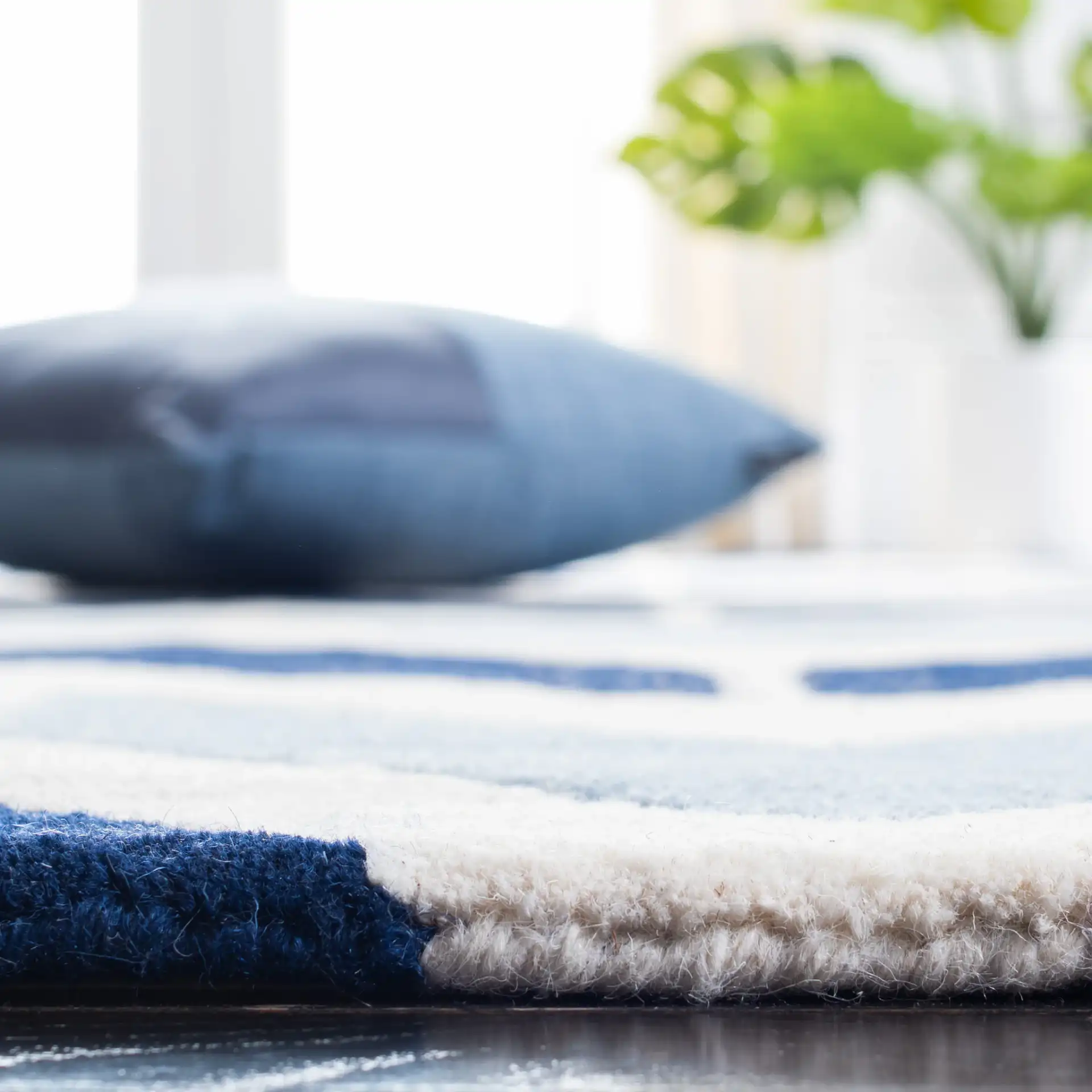 Chatham Arrow Chevron Hand-Tufted Wool Rug in Dark Blue / Light Blue in a styled room