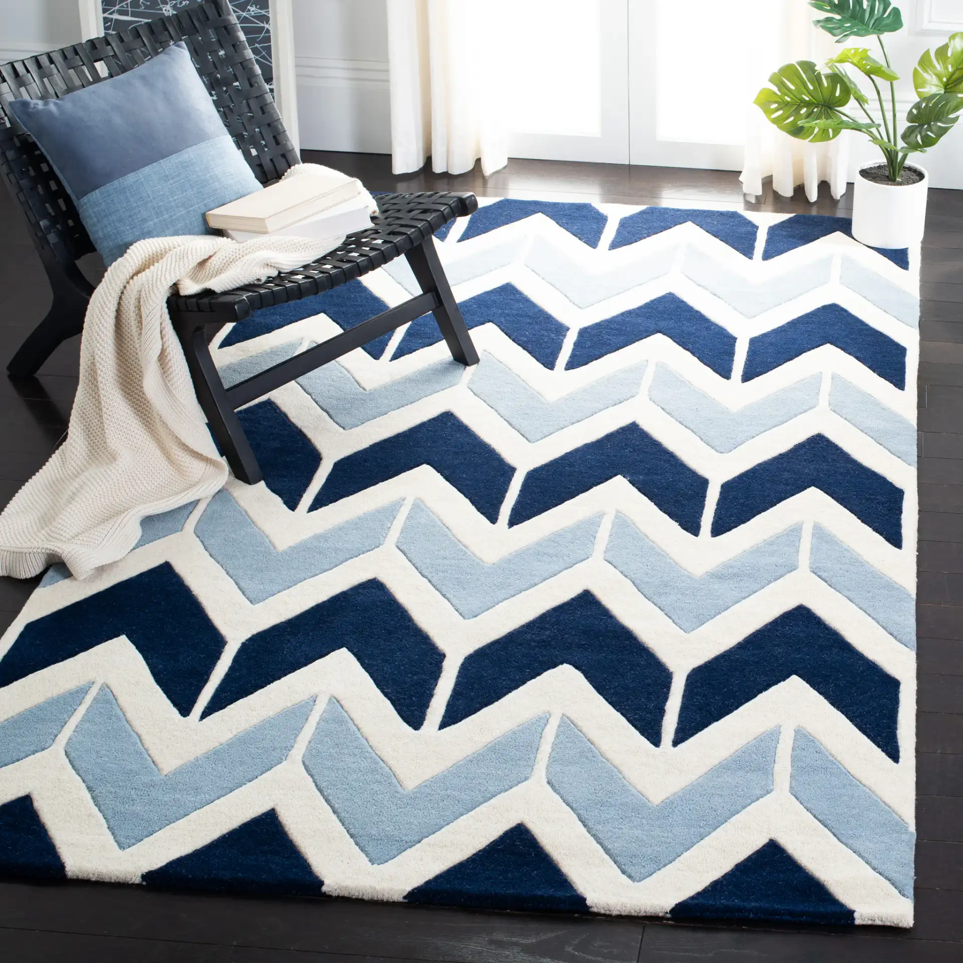 Chatham Arrow Chevron Hand-Tufted Wool Rug in Dark Blue / Light Blue in a styled room