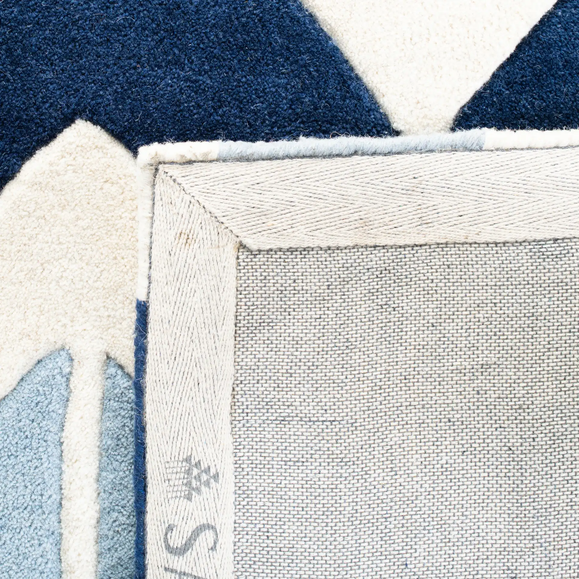 Chatham Arrow Chevron Hand-Tufted Wool Rug in Dark Blue / Light Blue in a styled room