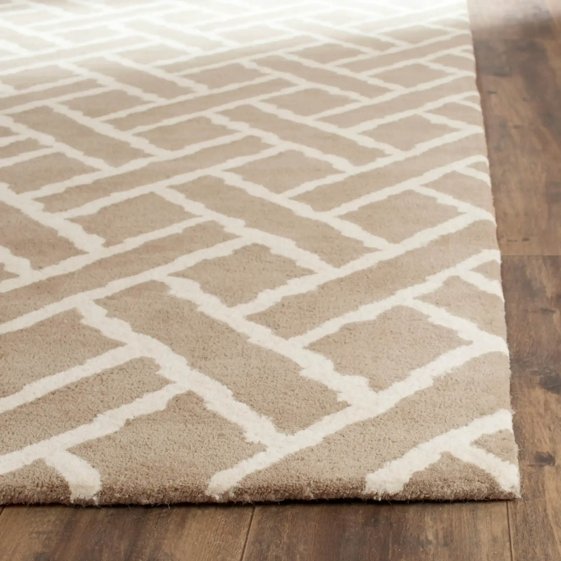 Chatham Lattice Hand-Tufted Wool Rug in Beige / Ivory in a styled room