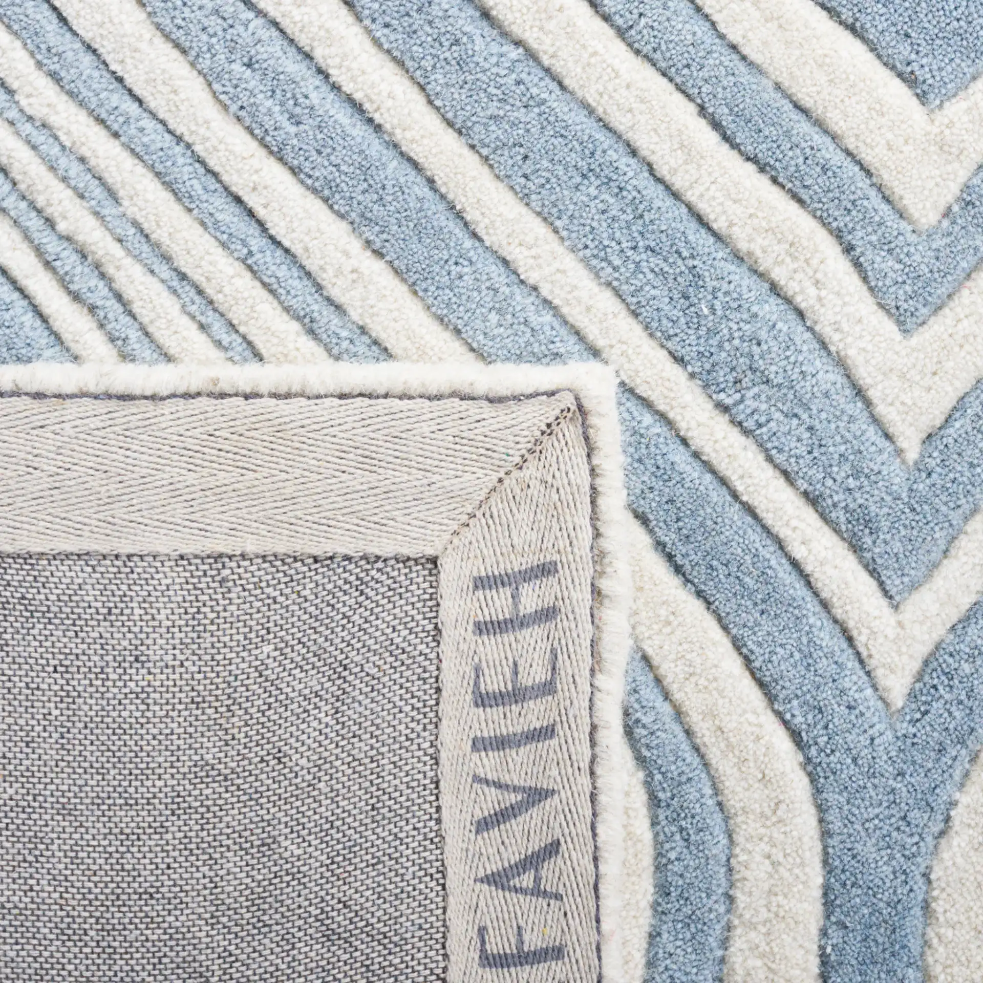 Chatham Wavy Trellis Hand-Tufted Wool Rug in Blue / Ivory in a styled room