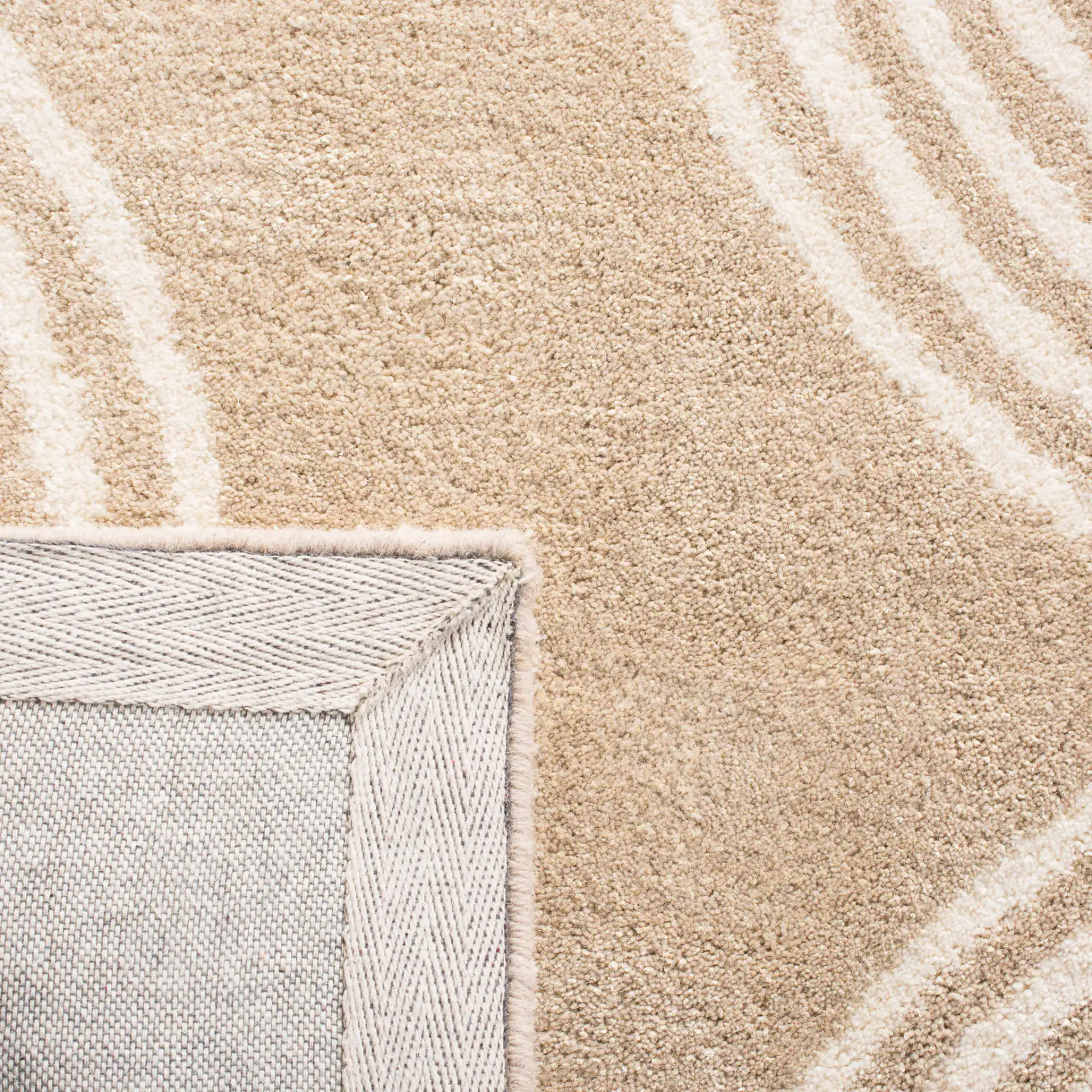 Chatham Wavy Stripe Hand-Tufted Wool Rug in Beige / Ivory in a styled room