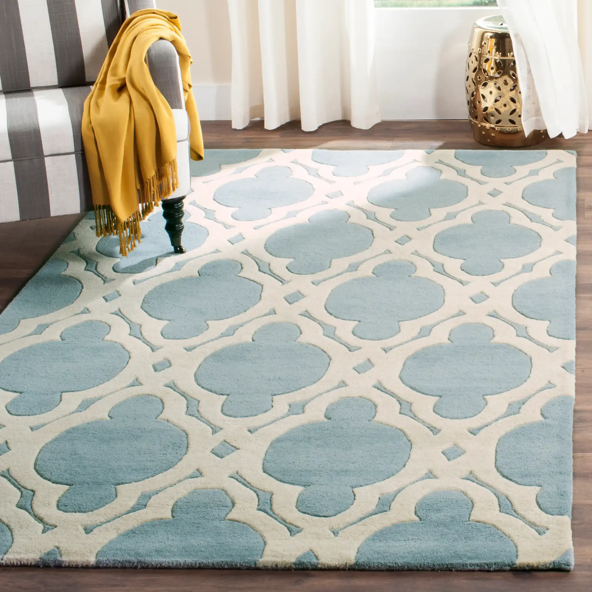 Chatham Moroccan Quatrefoil Hand-Tufted Wool Rug in Blue / Ivory in a styled room