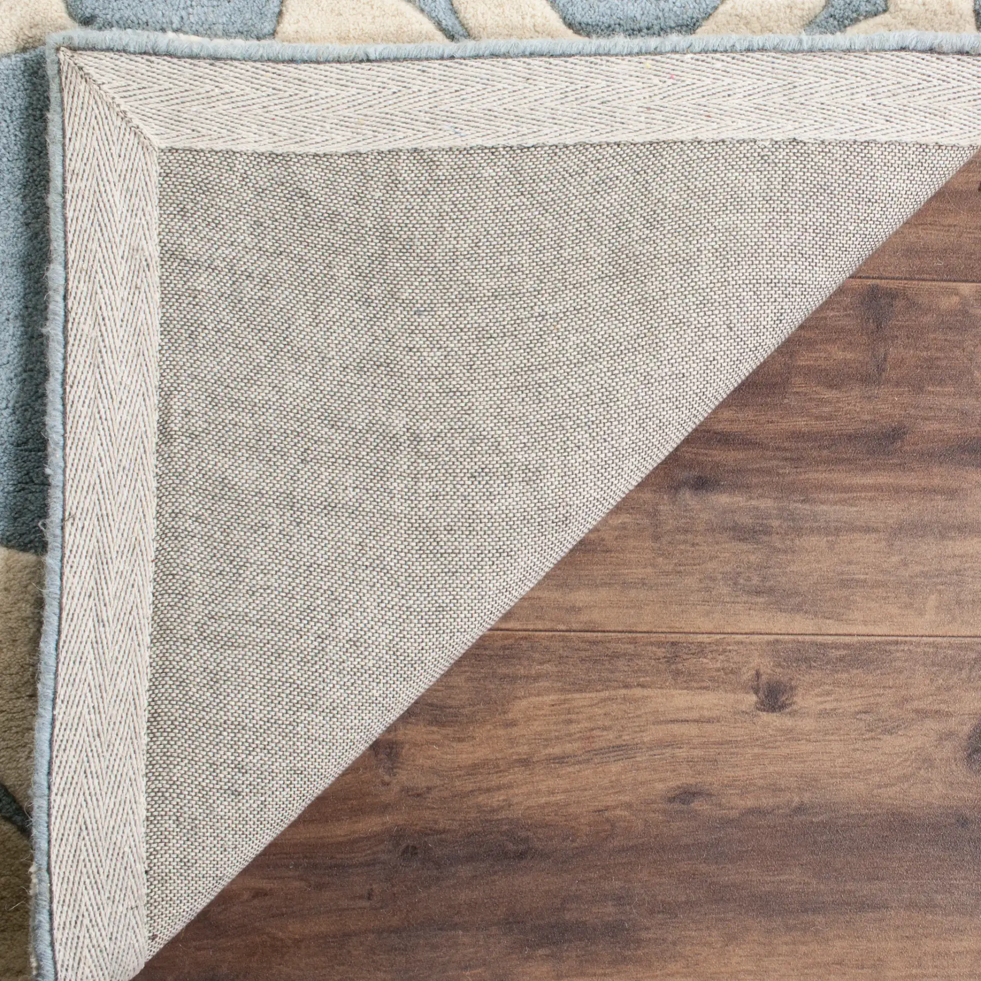 Chatham Moroccan Quatrefoil Hand-Tufted Wool Rug in Blue / Ivory in a styled room