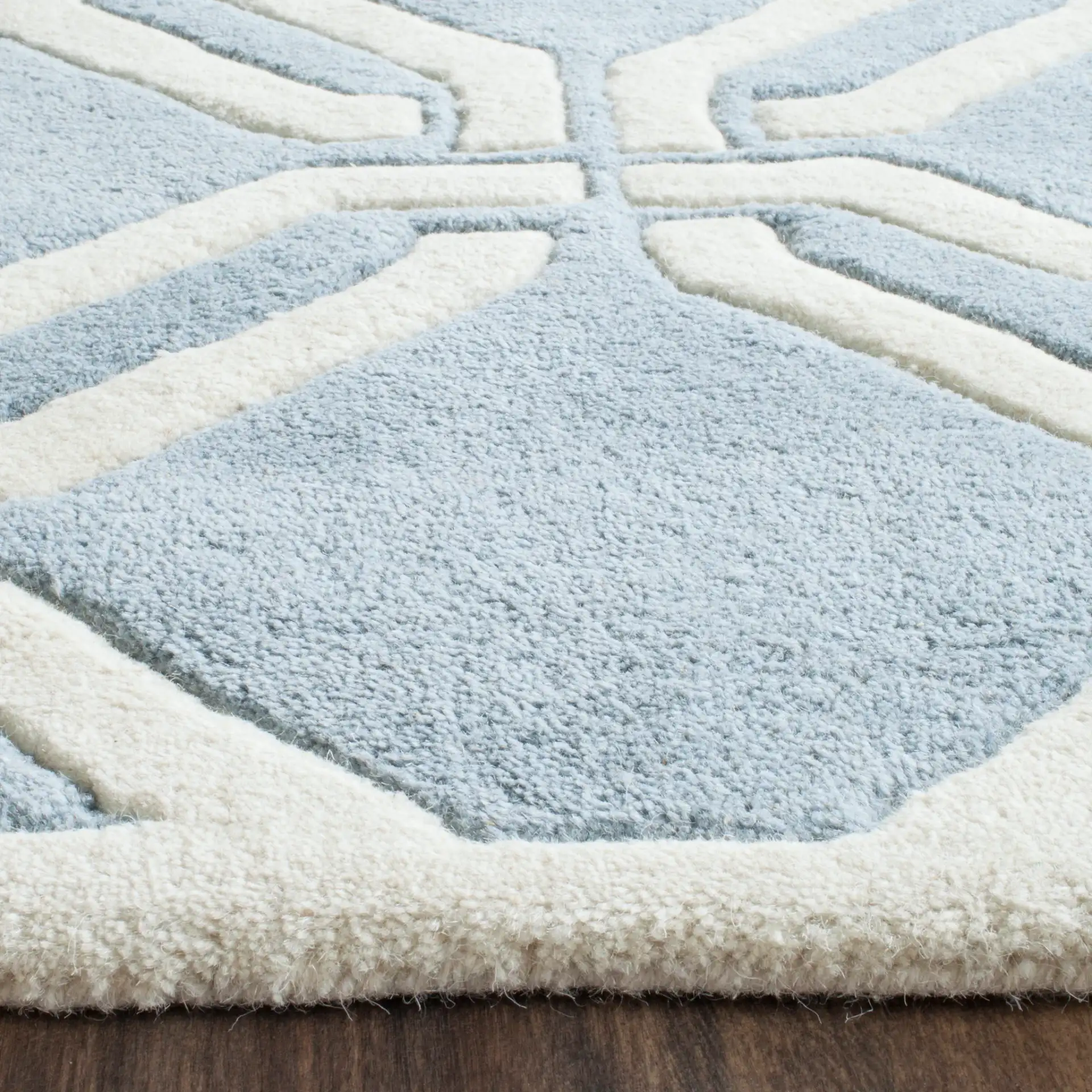 Chatham Interlocking Loop Hand-Tufted Wool Rug in Blue / Ivory in a styled room