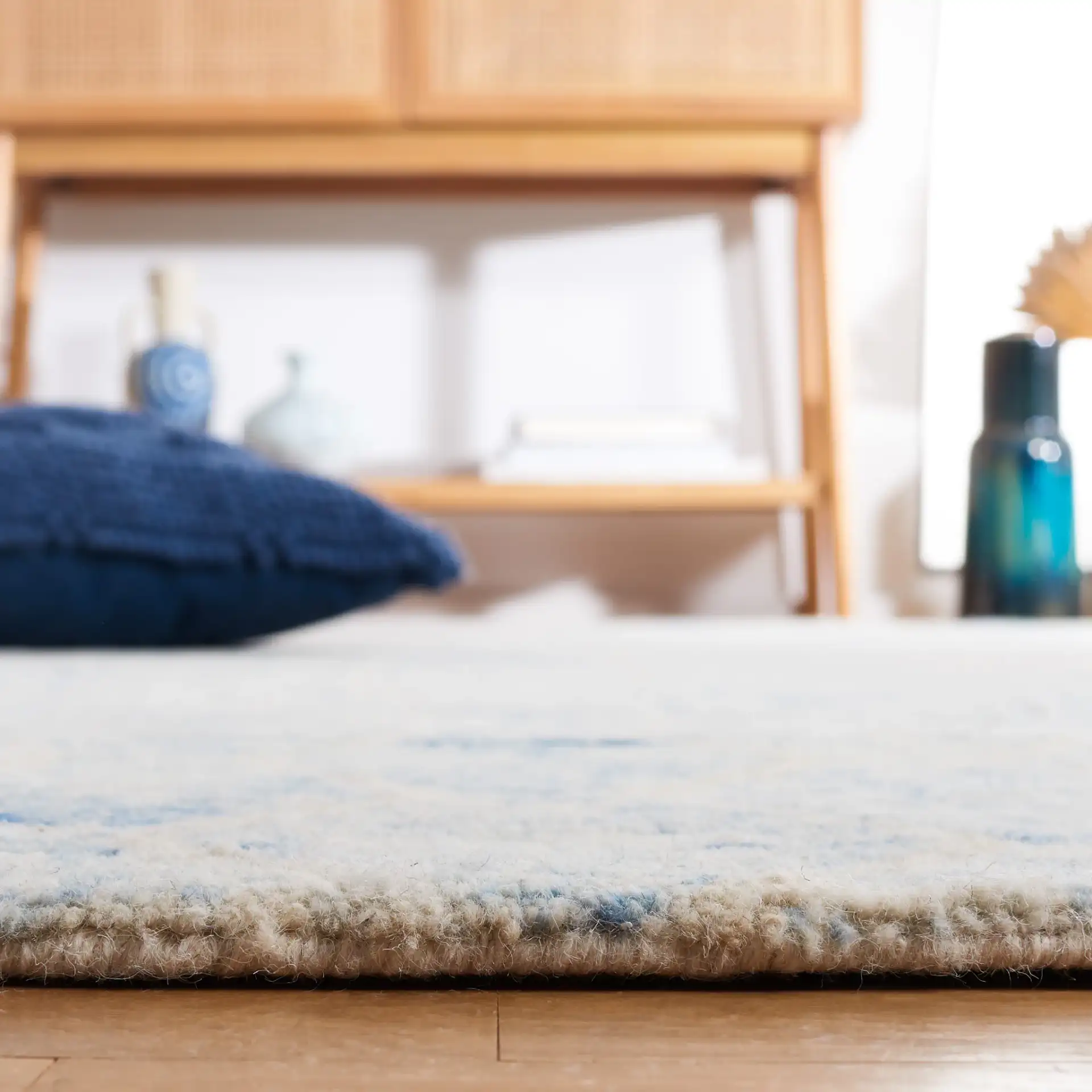 Chatham Banded Tribal Hand-Tufted Wool Rug in Blue / Ivory in a styled room