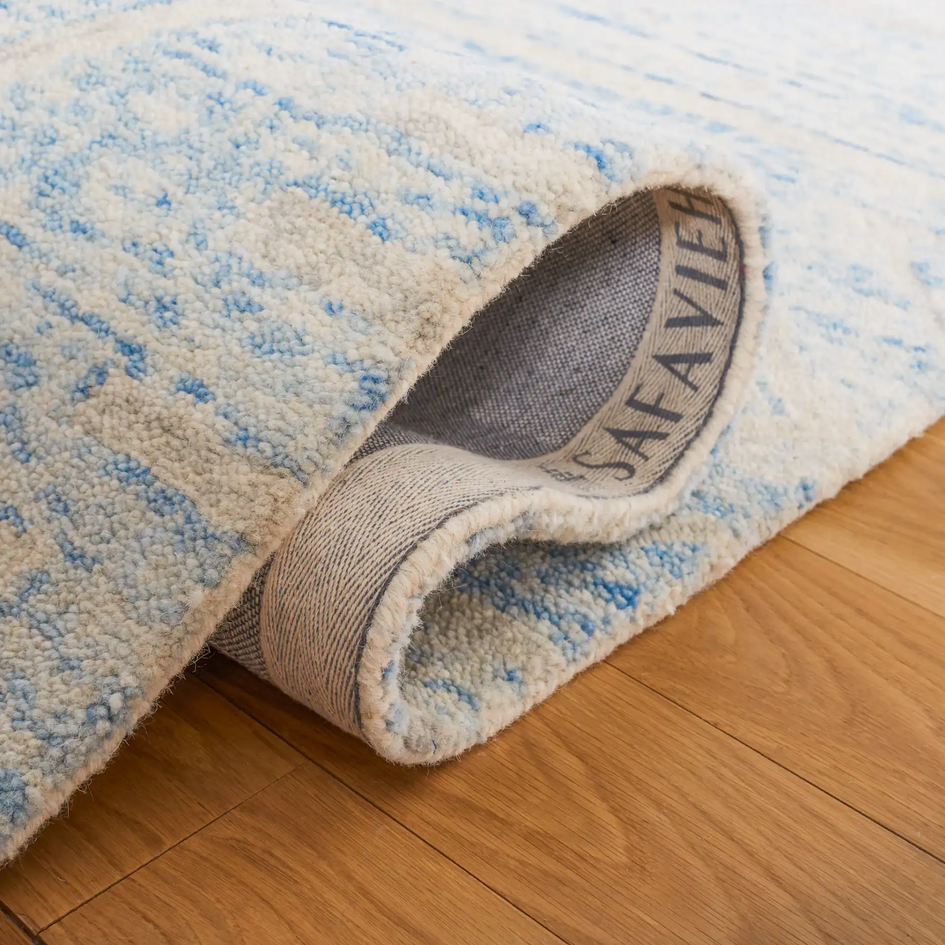 Chatham Banded Tribal Hand-Tufted Wool Rug in Blue / Ivory in a styled room
