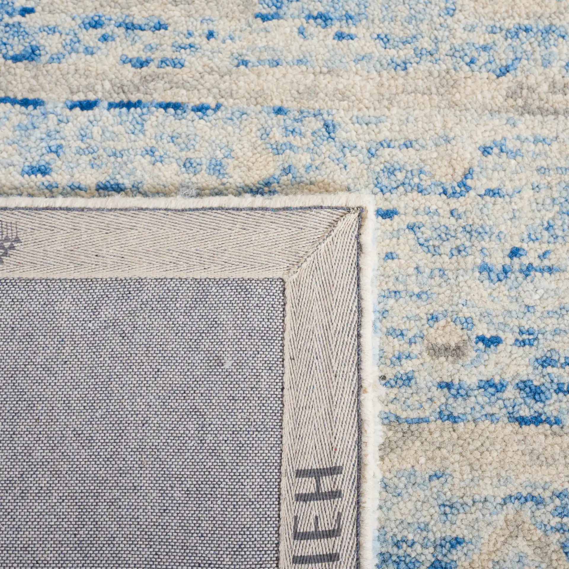 Chatham Banded Tribal Hand-Tufted Wool Rug in Blue / Ivory in a styled room