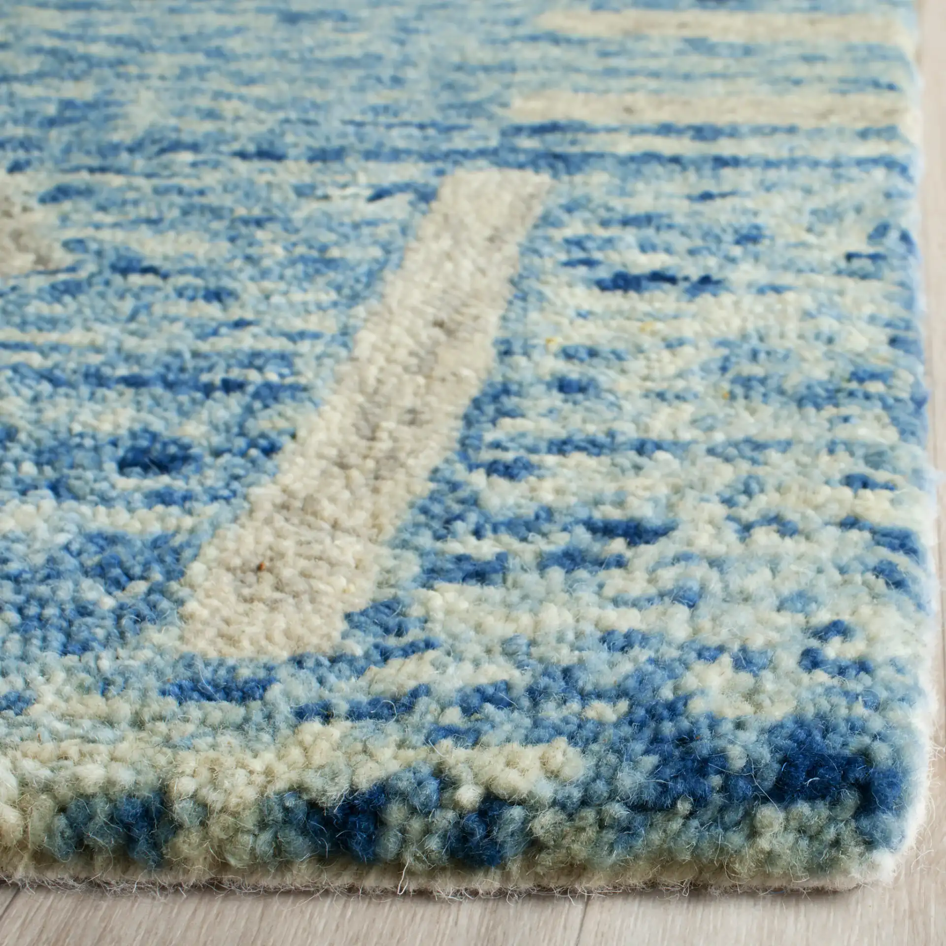 Chatham Banded Tribal Hand-Tufted Wool Rug in Blue / Ivory in a styled room